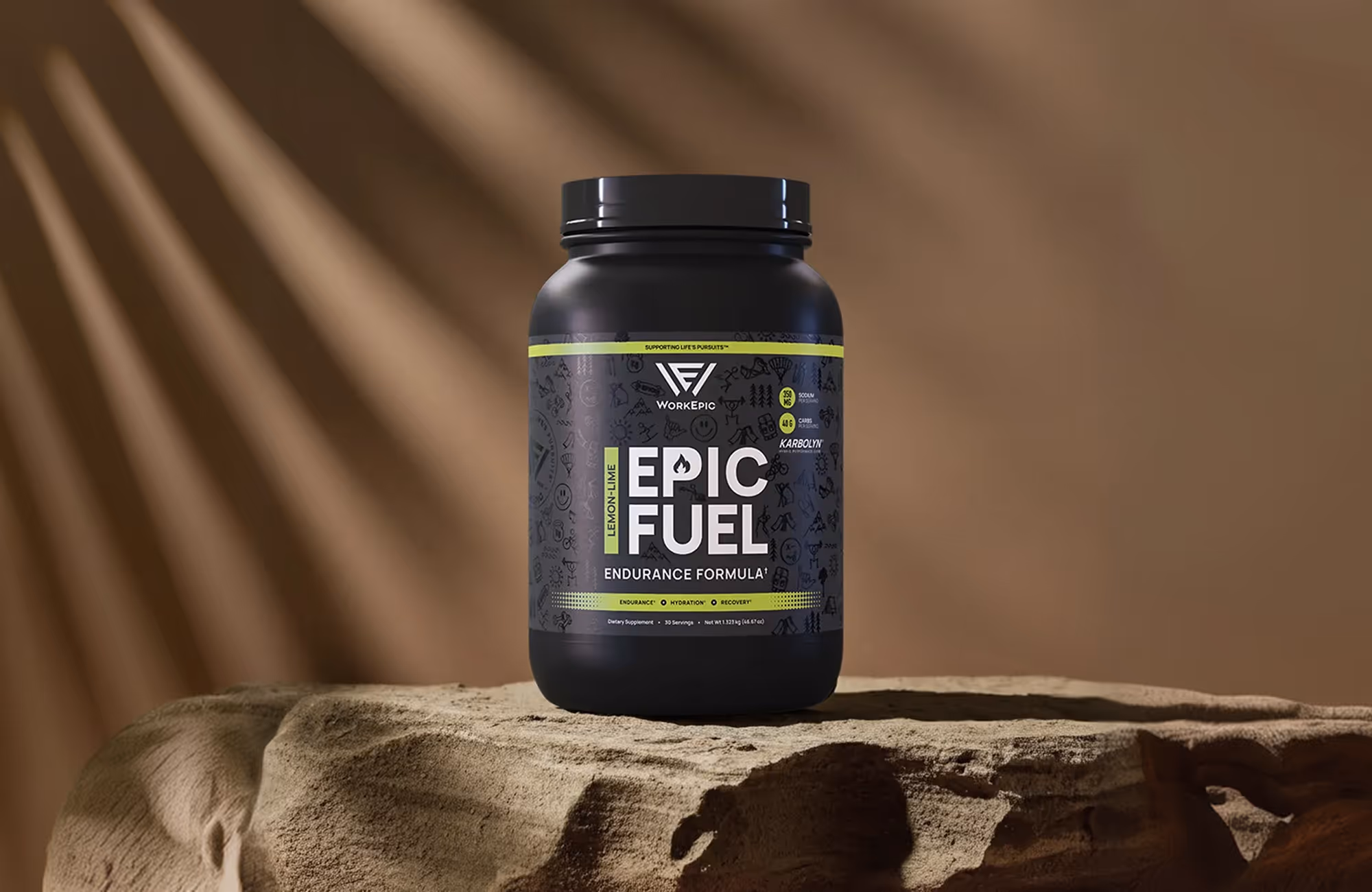 Black container of WorkEpic Epic Fuel lemon-lime endurance formula on a textured stone surface.