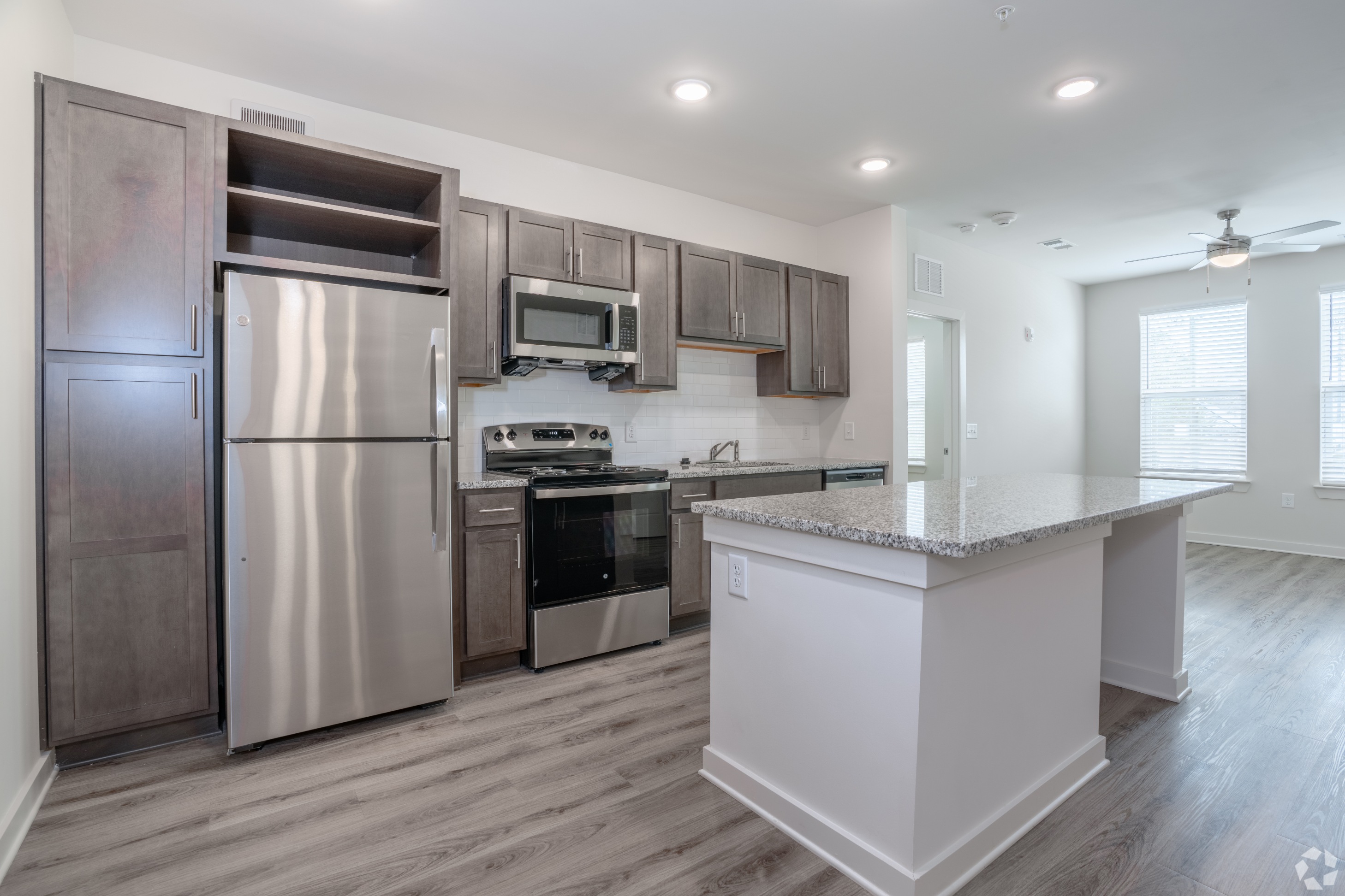 Kitchen with living room in the background