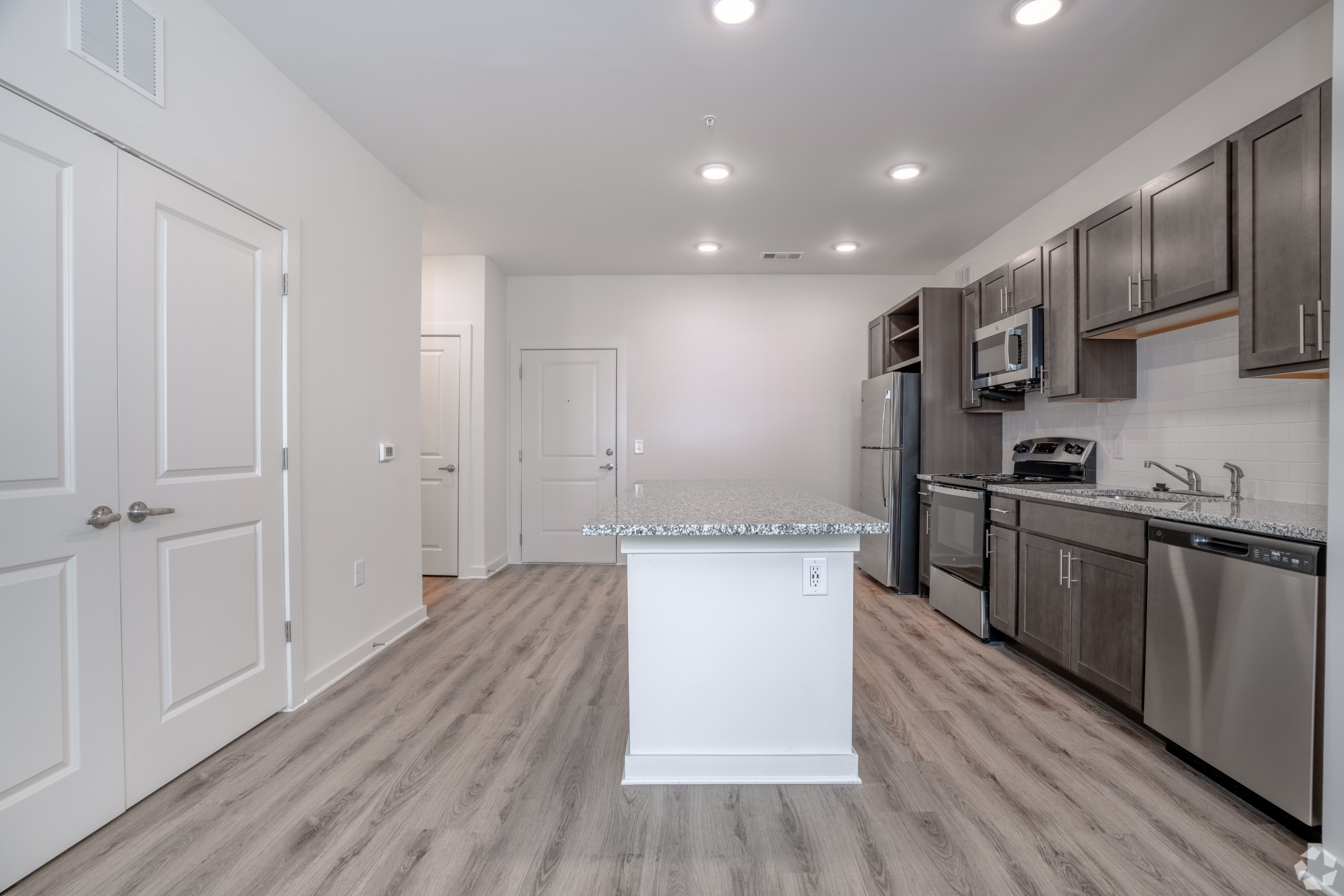 Wider view of kitchen from the living room