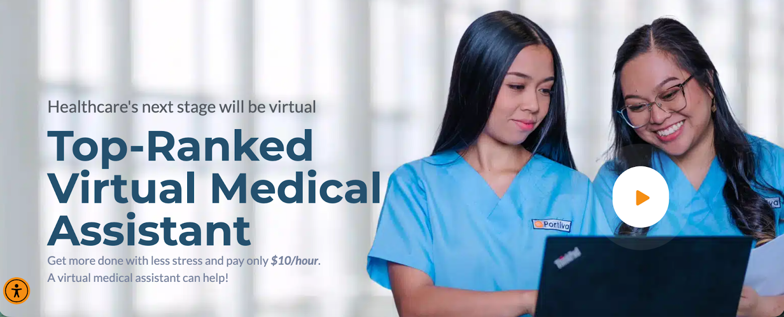 Two clinicians smiling at a computer