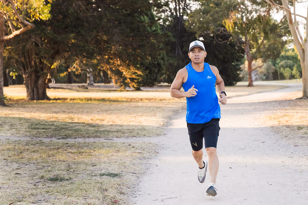 Lino running through a park.
