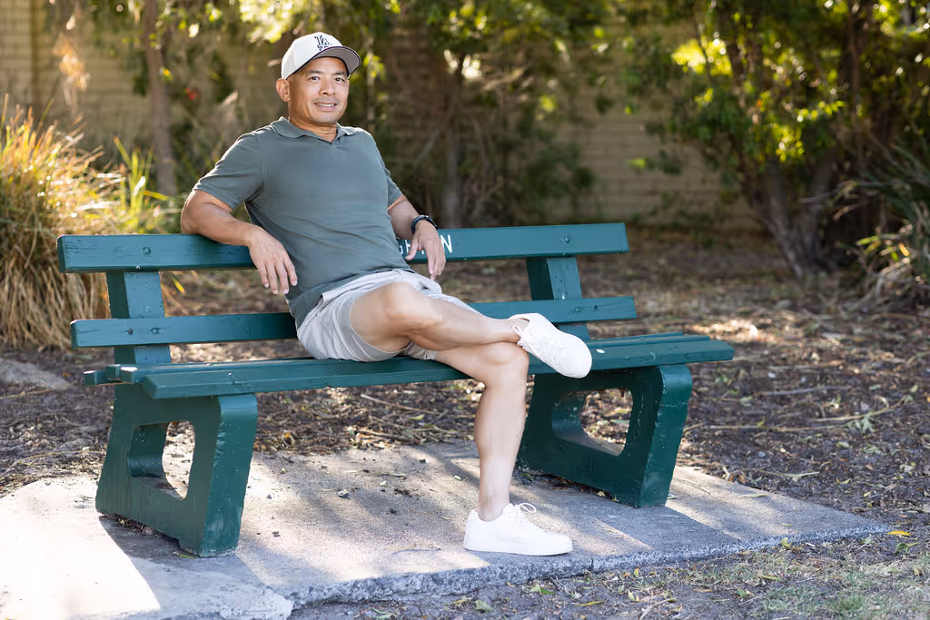 Lino sitting on a bench 2