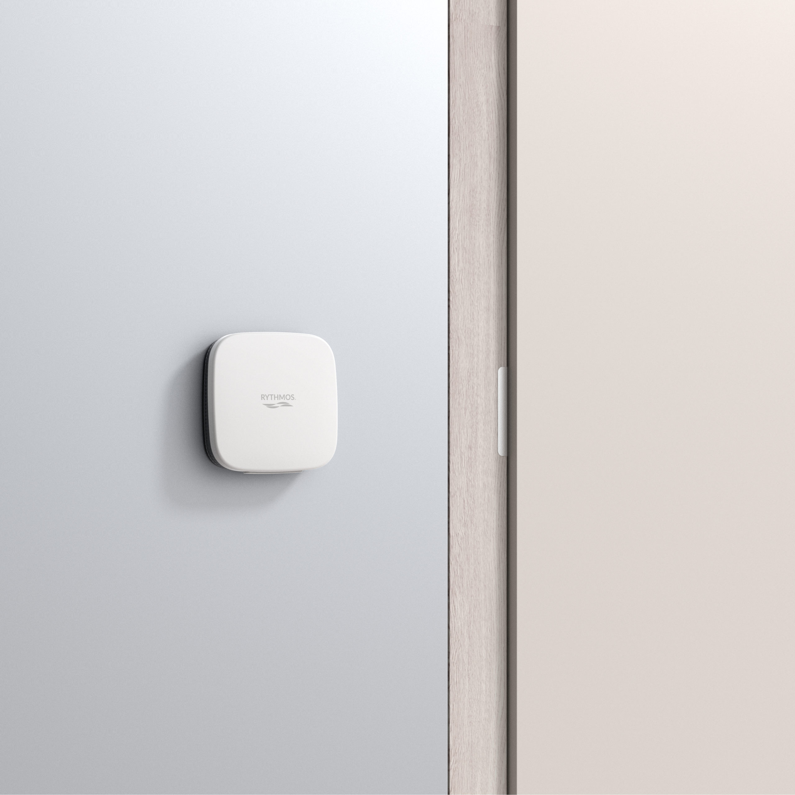 Rythmos Access Control Reader mounted on wall beside door