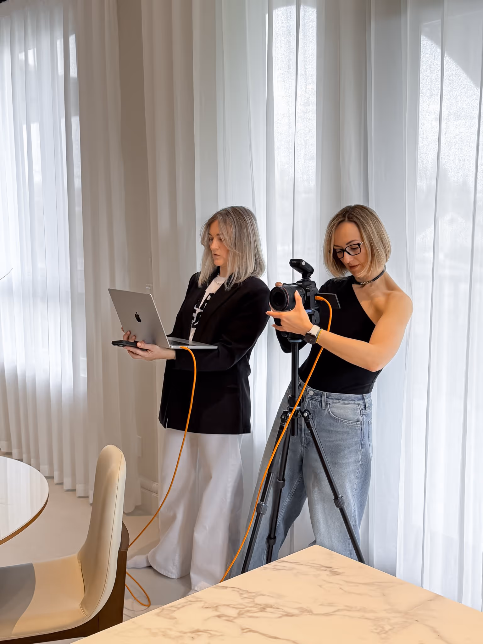 Interior photography session with photographers capturing a modern kitchen in natural light