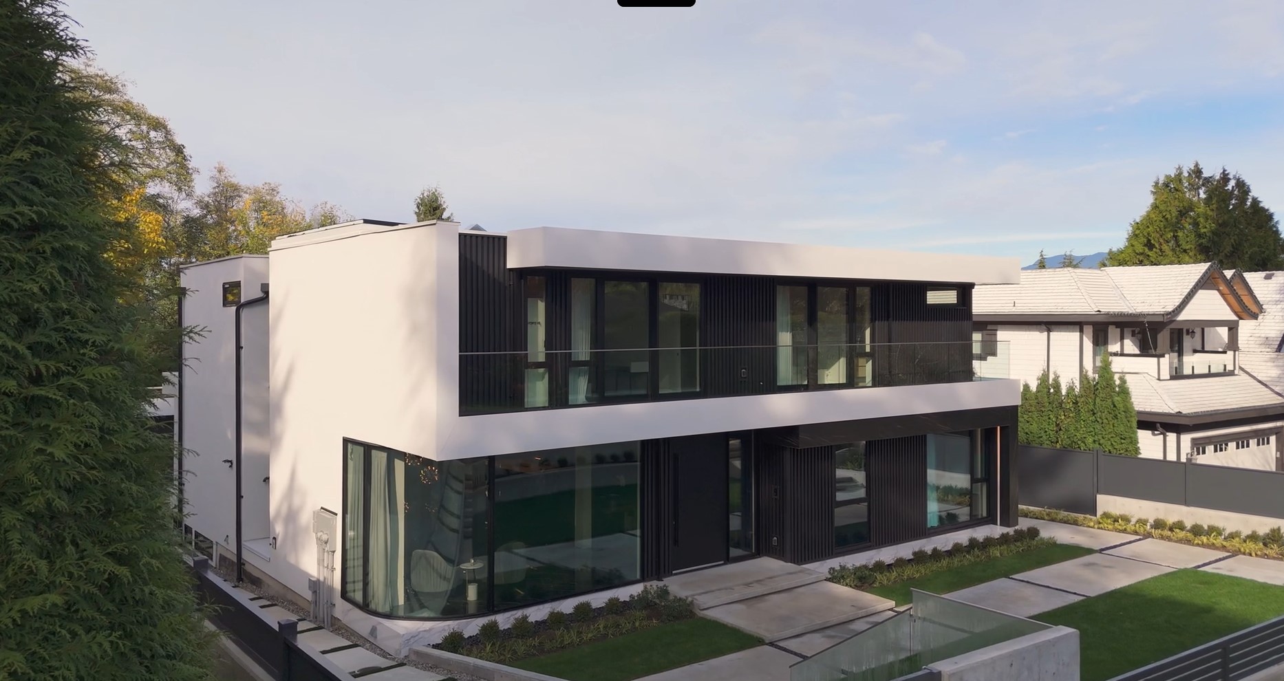 Modern luxury home exterior with glass facade and clean lines, Burnaby BC architectural photography