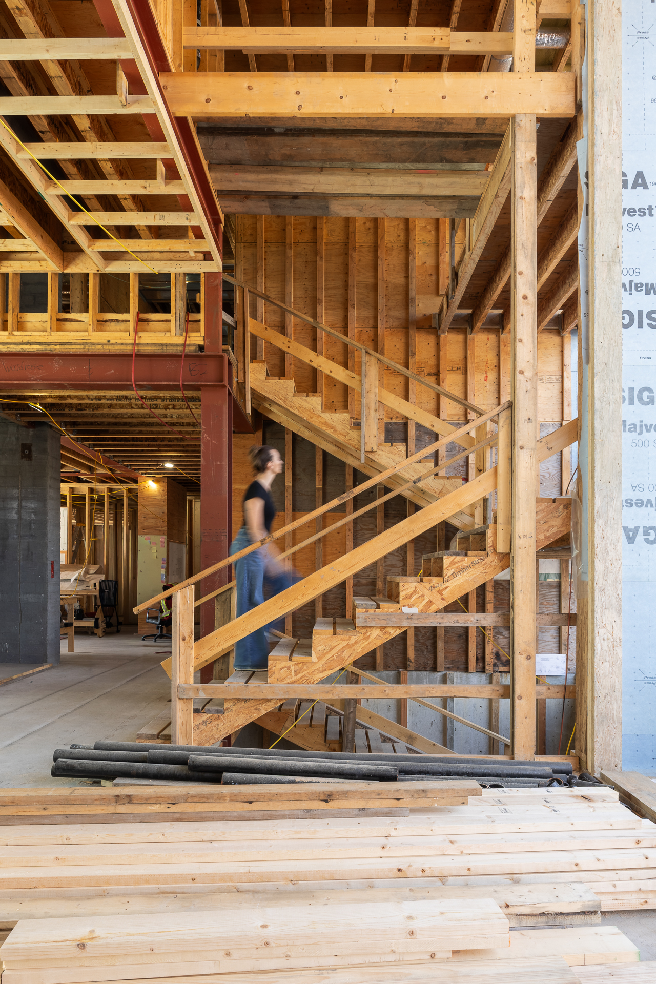 Costraction progress, interior, designer moving upstairs, motion blur