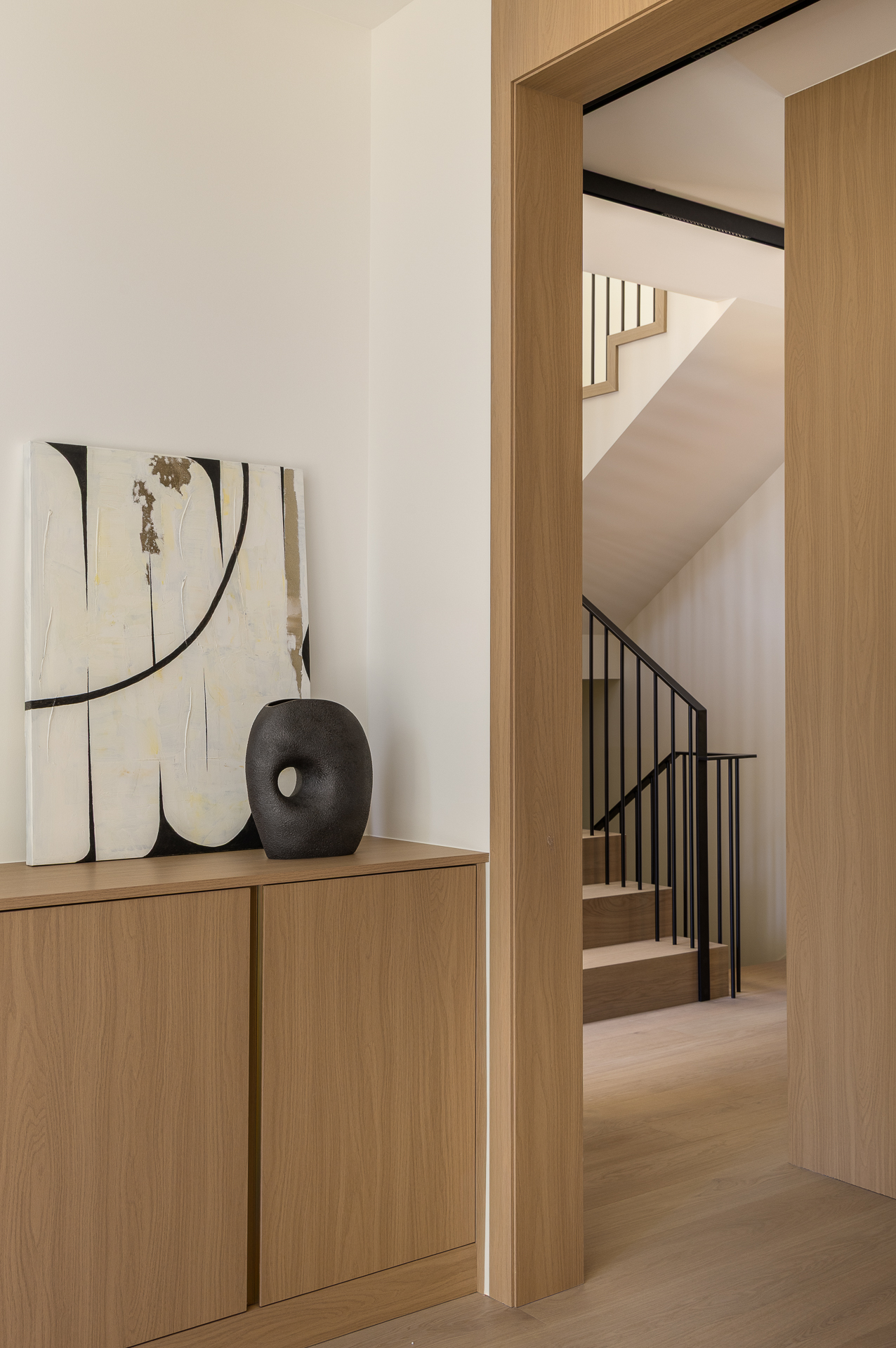 Entrance hallway art and sculptural vase detail, The Oku House, Vancouver