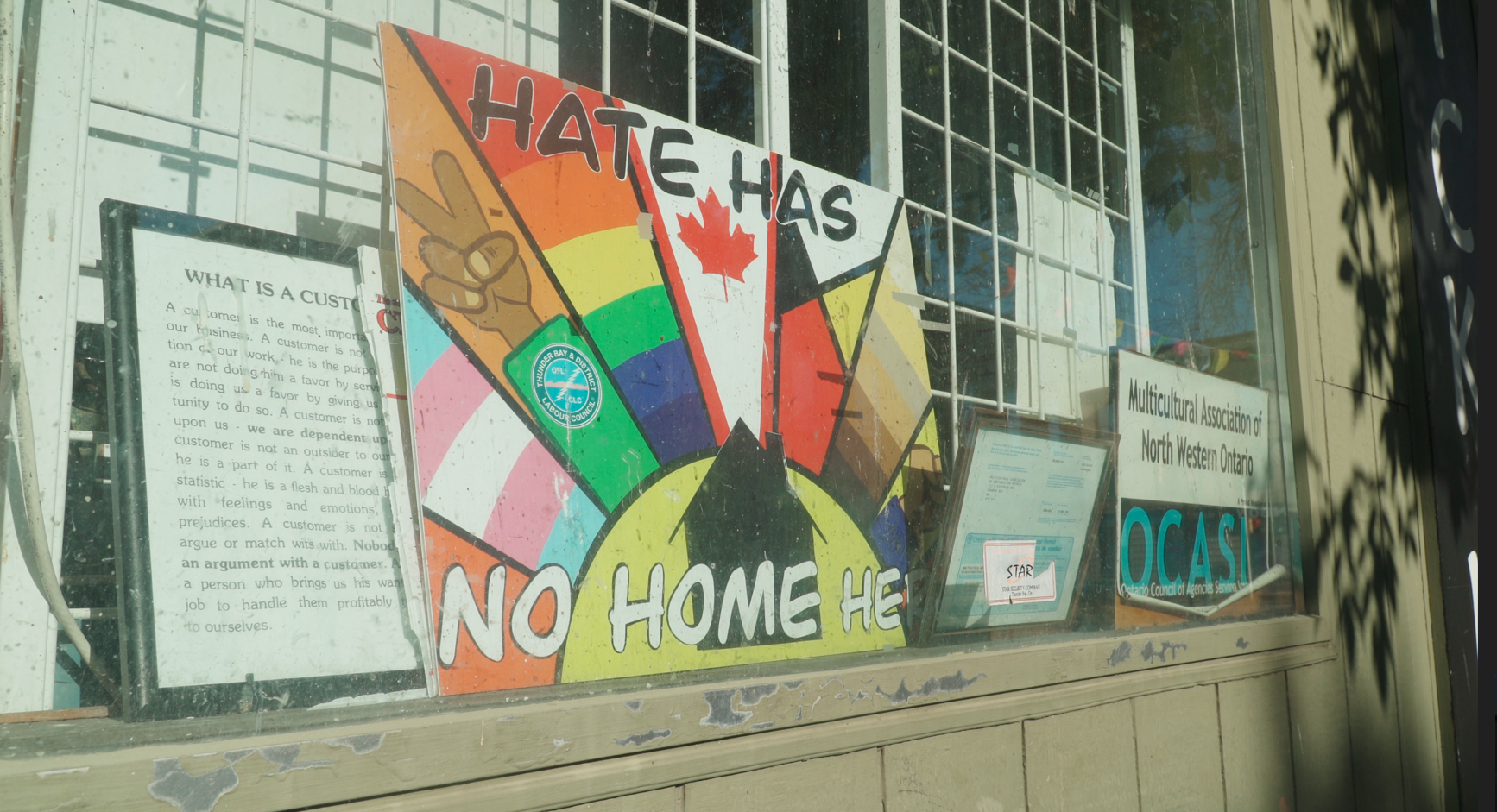 A colourful sign saying "hate has no home here"