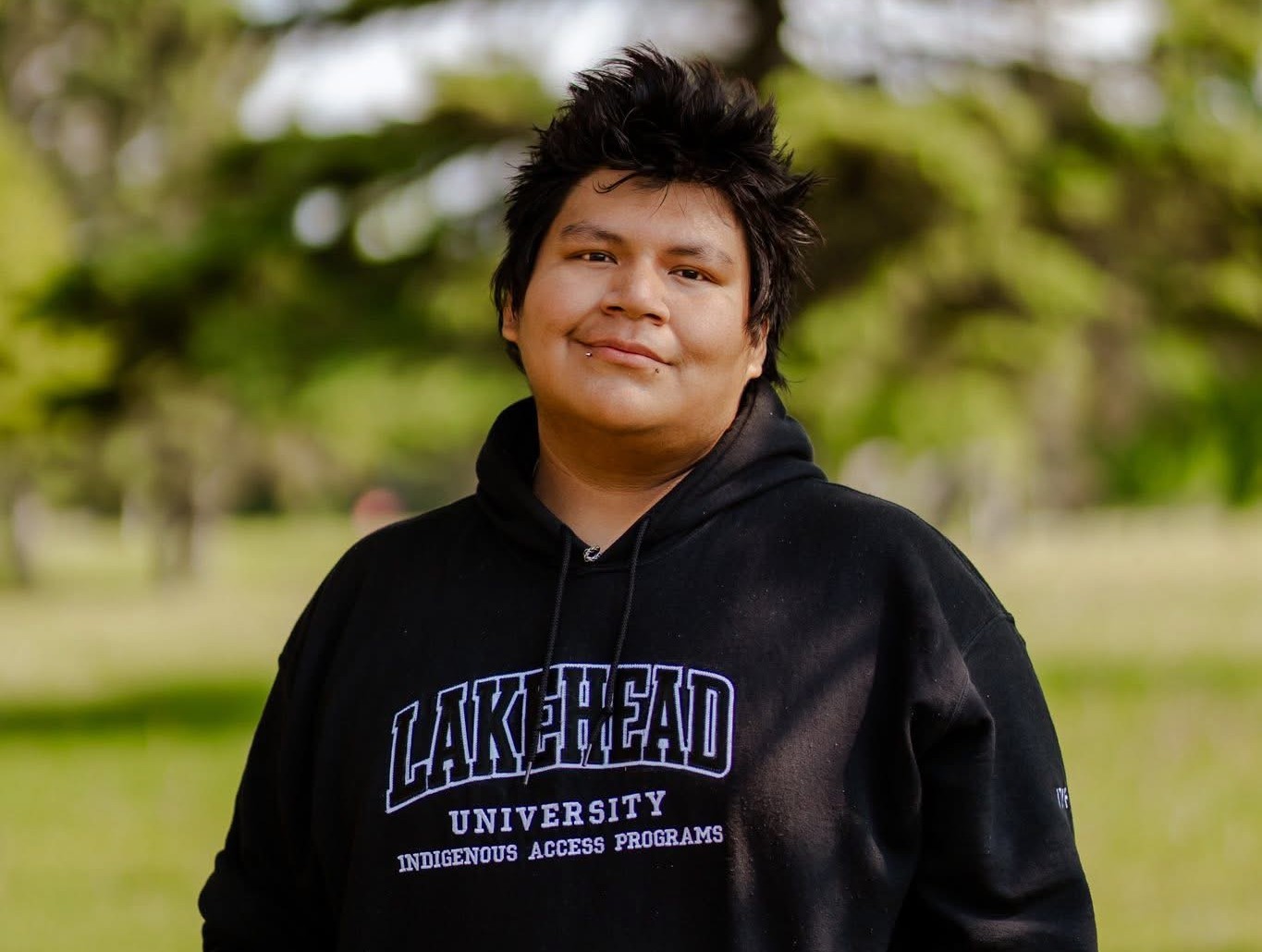 Photo of Malakai Mawageesick in Lakehead sweater.