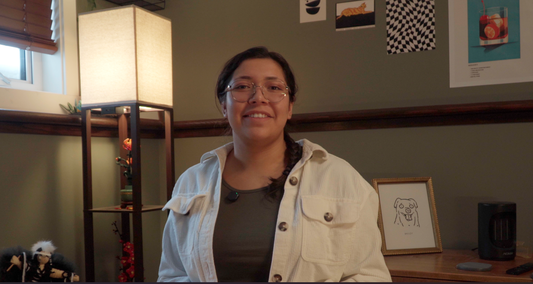 Photo of Tisha Duncan smiling wearing a white cardigan