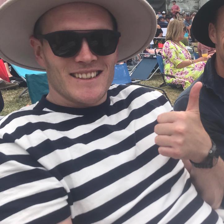 Nice man in chair with thumbs up smiling