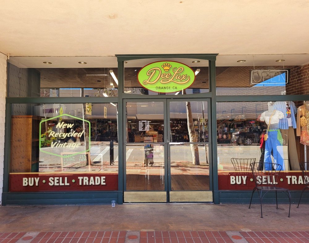 storefront and organized racks at deelux vintage and resale shop in old towne orange