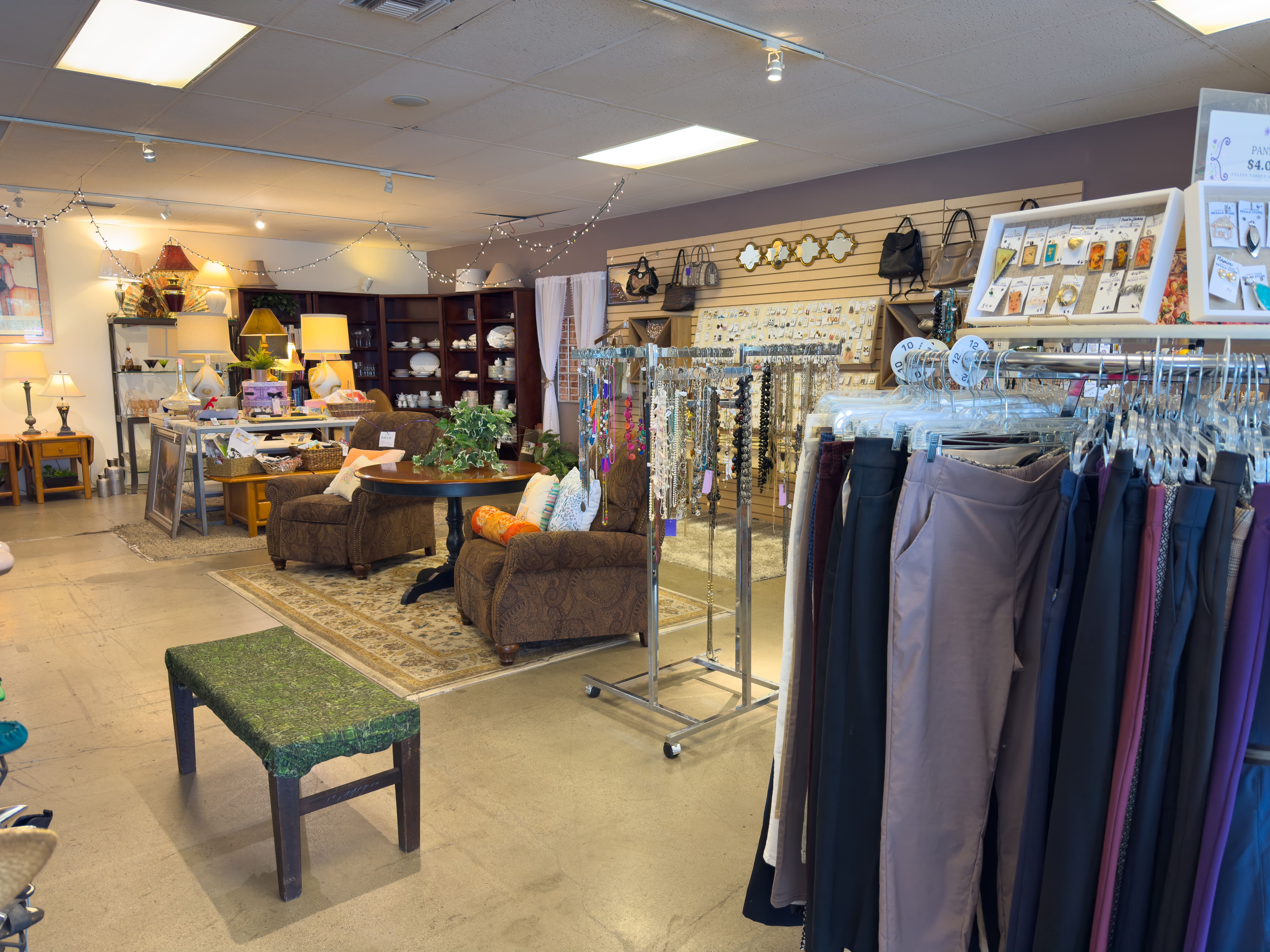 organized racks of brand-name resale clothing at laura's house in lake forest