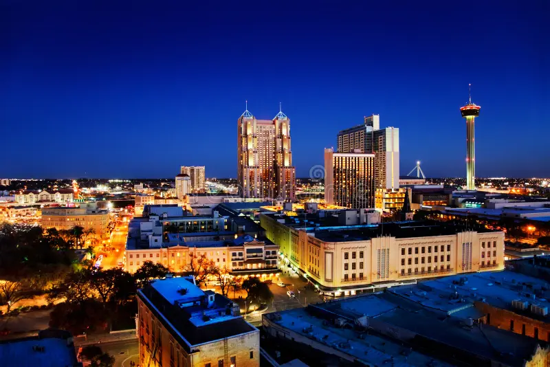 "San Antonio city skyline at night illustrating the 24-hour accessibility of our mobile nurse practitioner services across Bexar County.