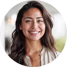 Friendly headshot with soft lighting and a neutral background.