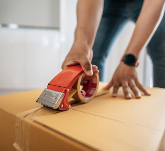Professional packing services in Melbourne with movers carefully wrapping fragile items in protective materials