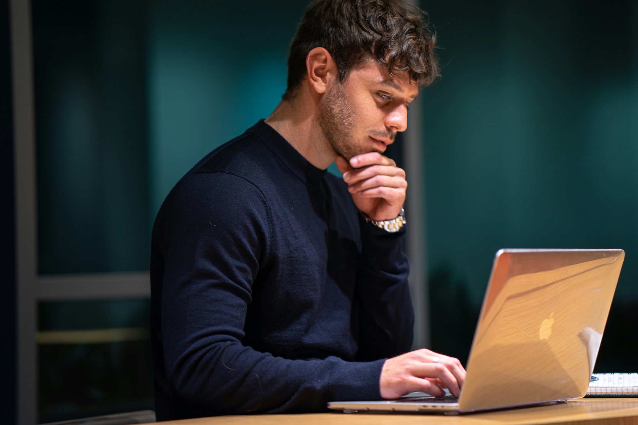 Man working on a website on their laptop