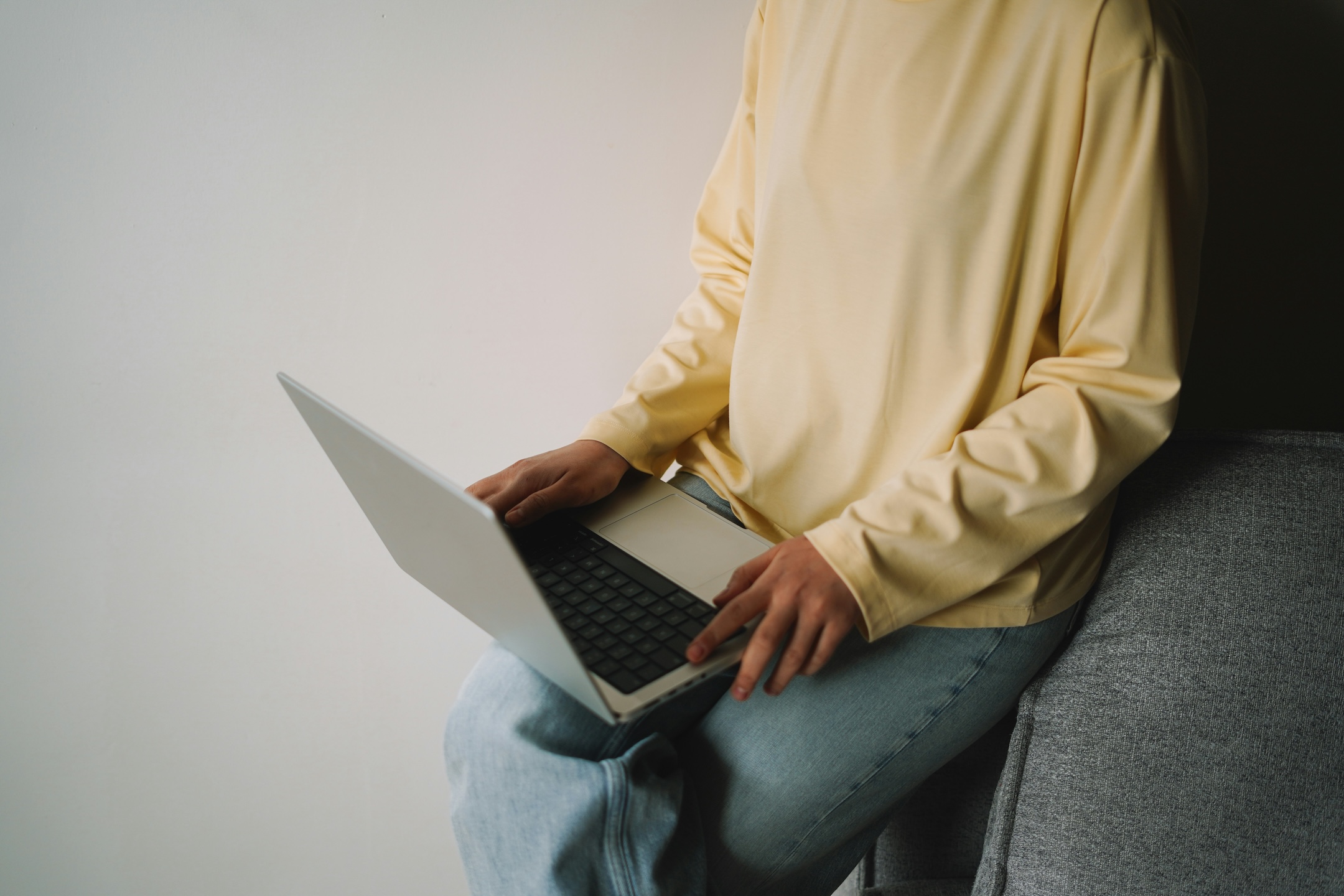 Man using laptop to browse his Headless CMS website built by Spacey Studios.