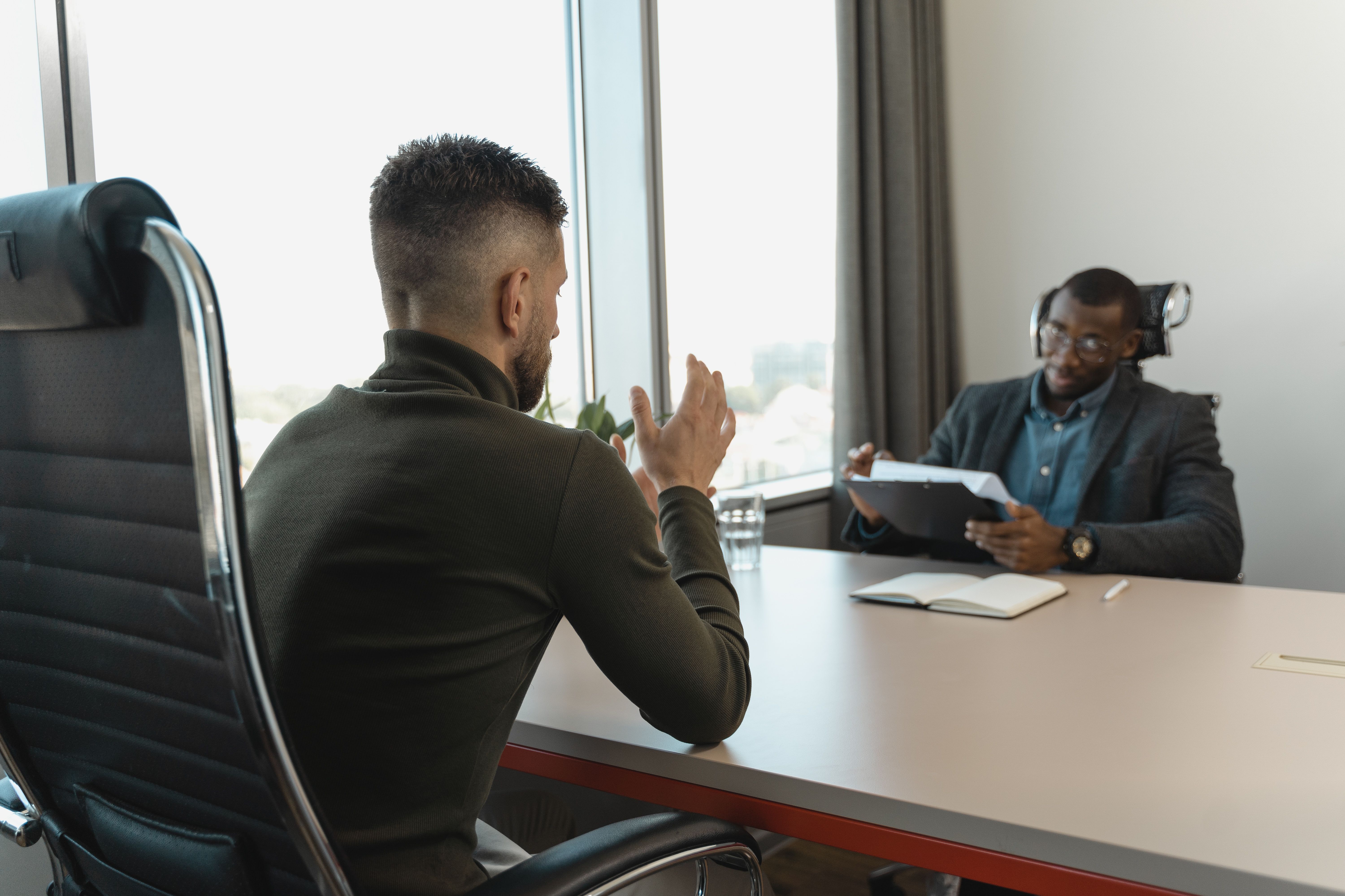 New hire and founder in tense one-on-one conversation