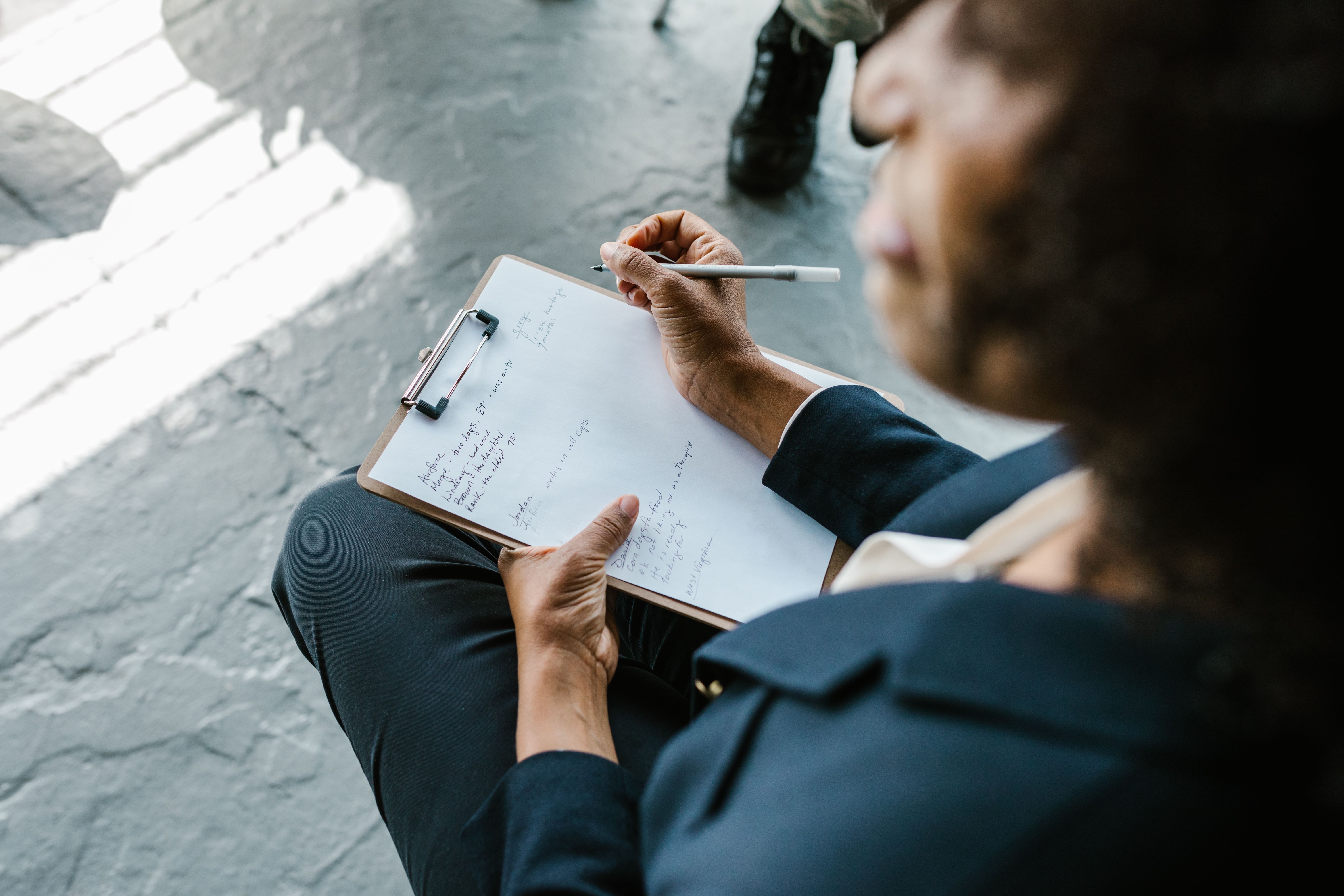 HR manager taking notes during an exit interview