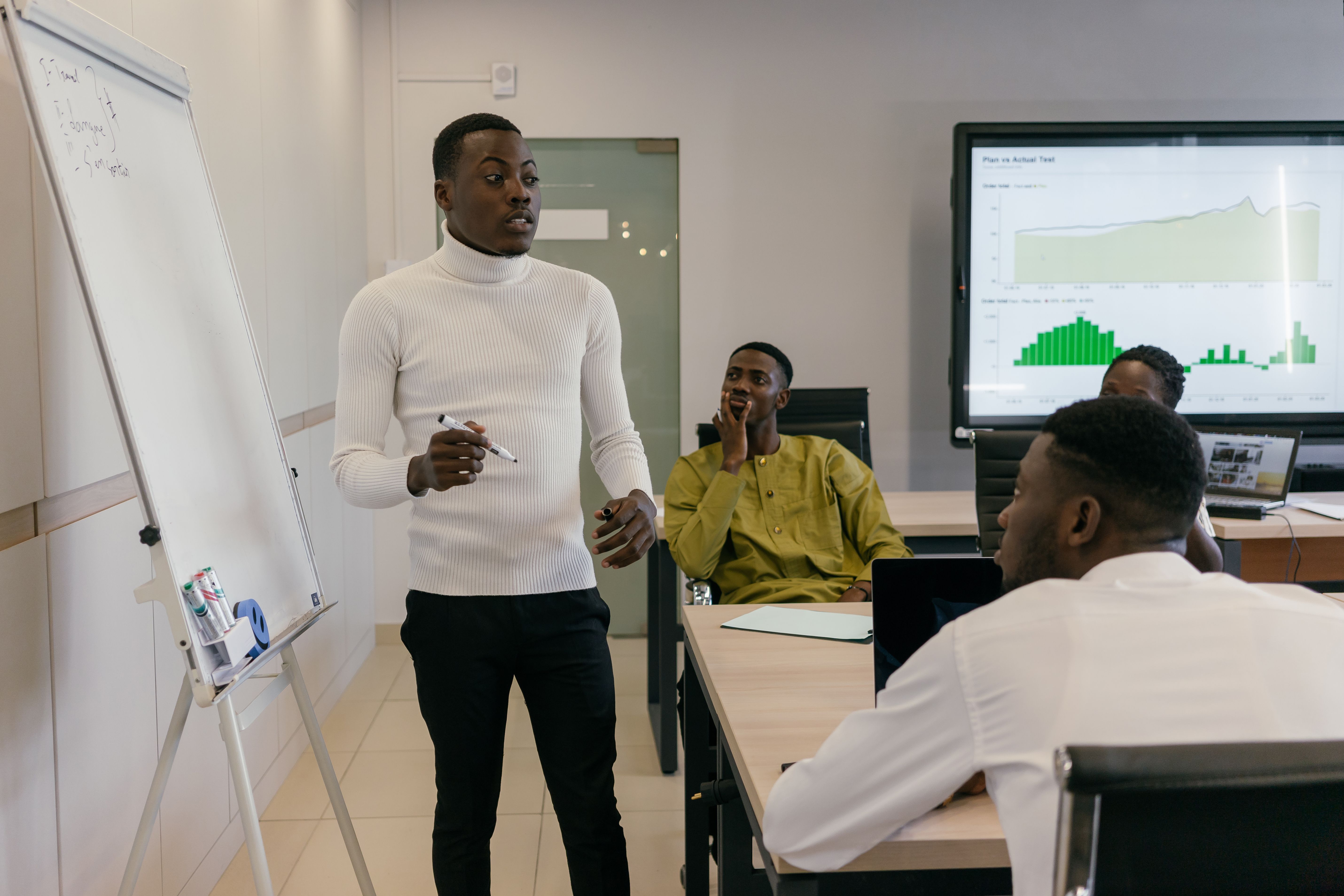 Manager giving direct feedback to a team member across a desk