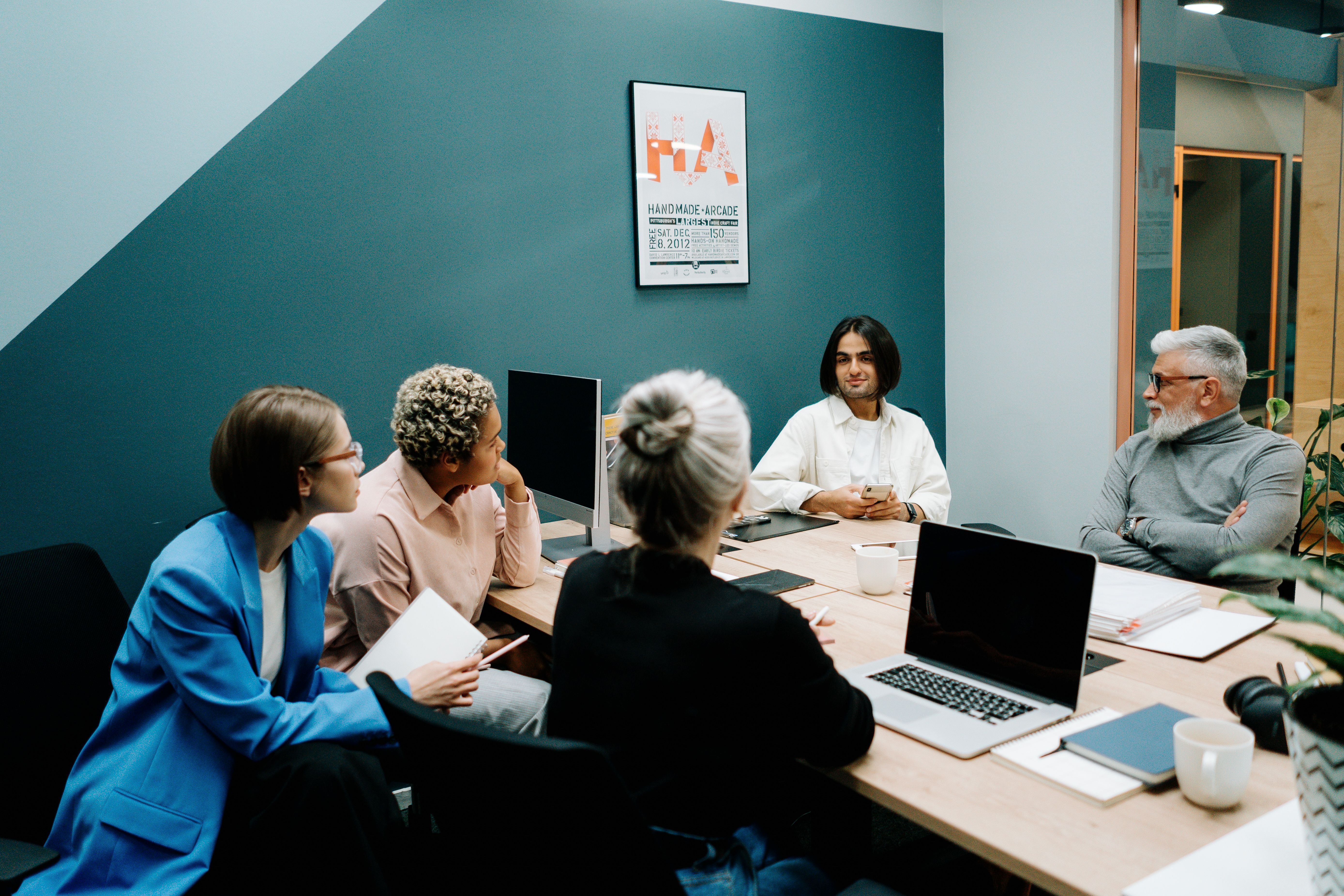 Executive team sitting in a circle looking skeptical during a training session