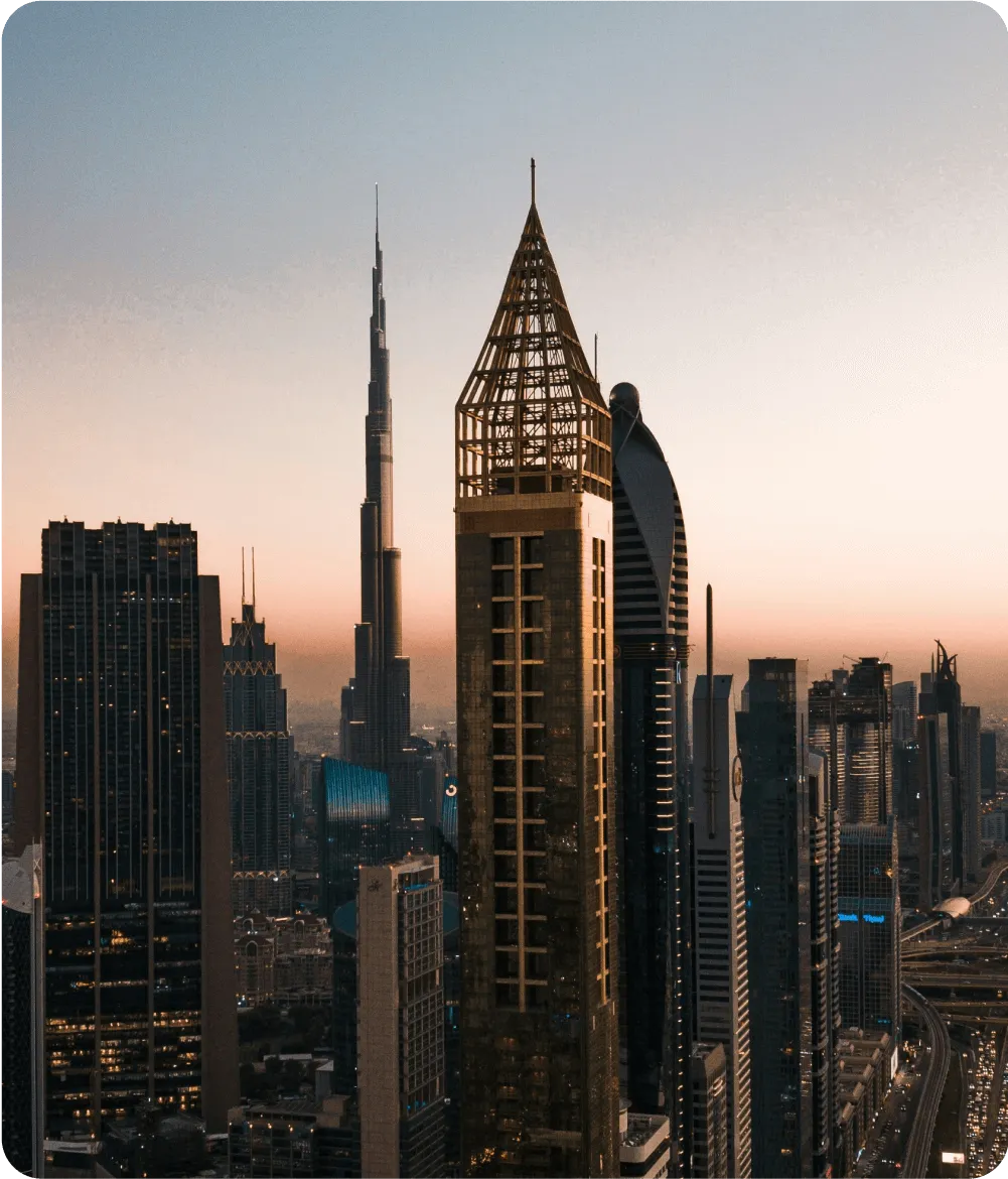 Business Setup In Dubai skyline with iconic Burj Khalifa at sunset