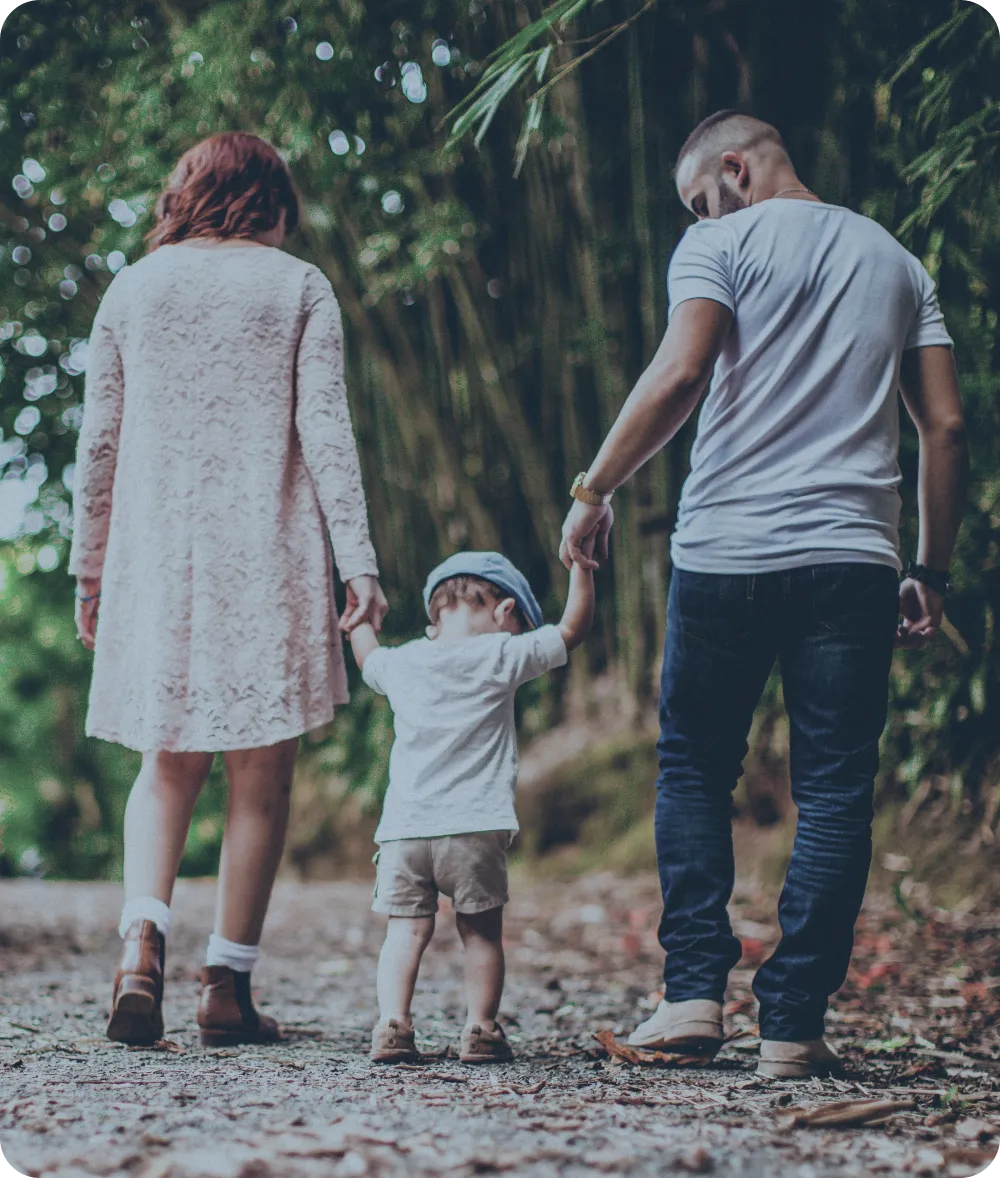 Business Setup In Dubai: Family Walking Together in Supportive Embrace