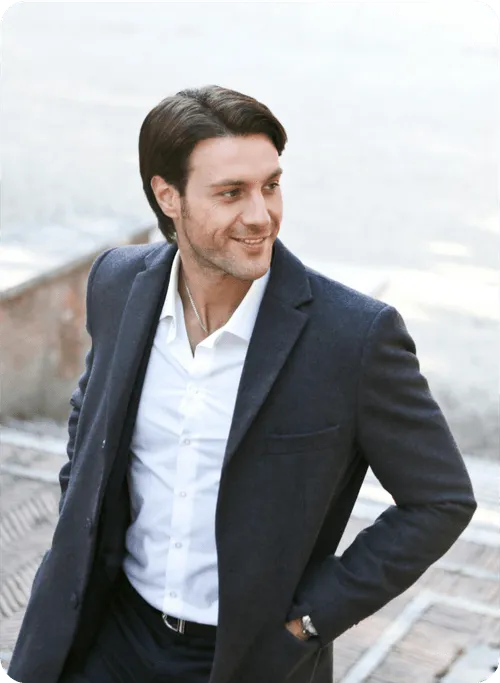 Best Business To Start In Dubai: Confident professional smiling outdoors