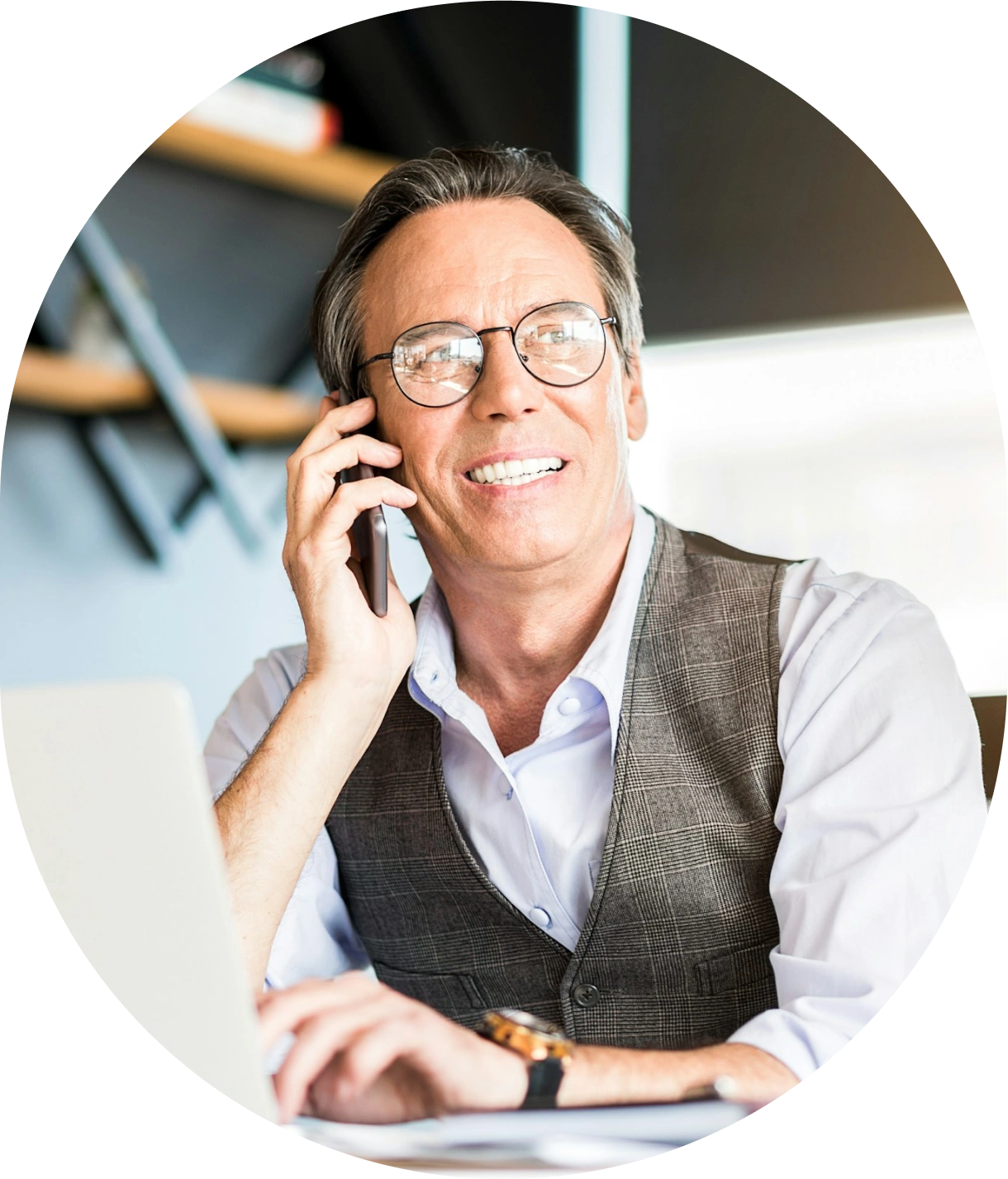 Meydan FZ business professional in vest smiling during phone call