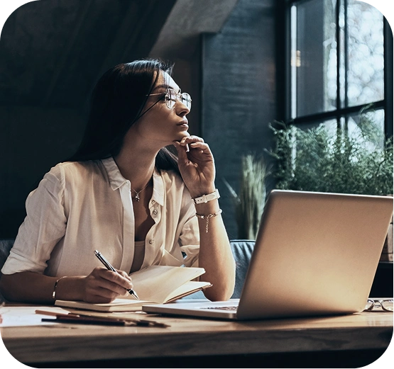Meydan FZ professional woman working at desk with laptop and decoration