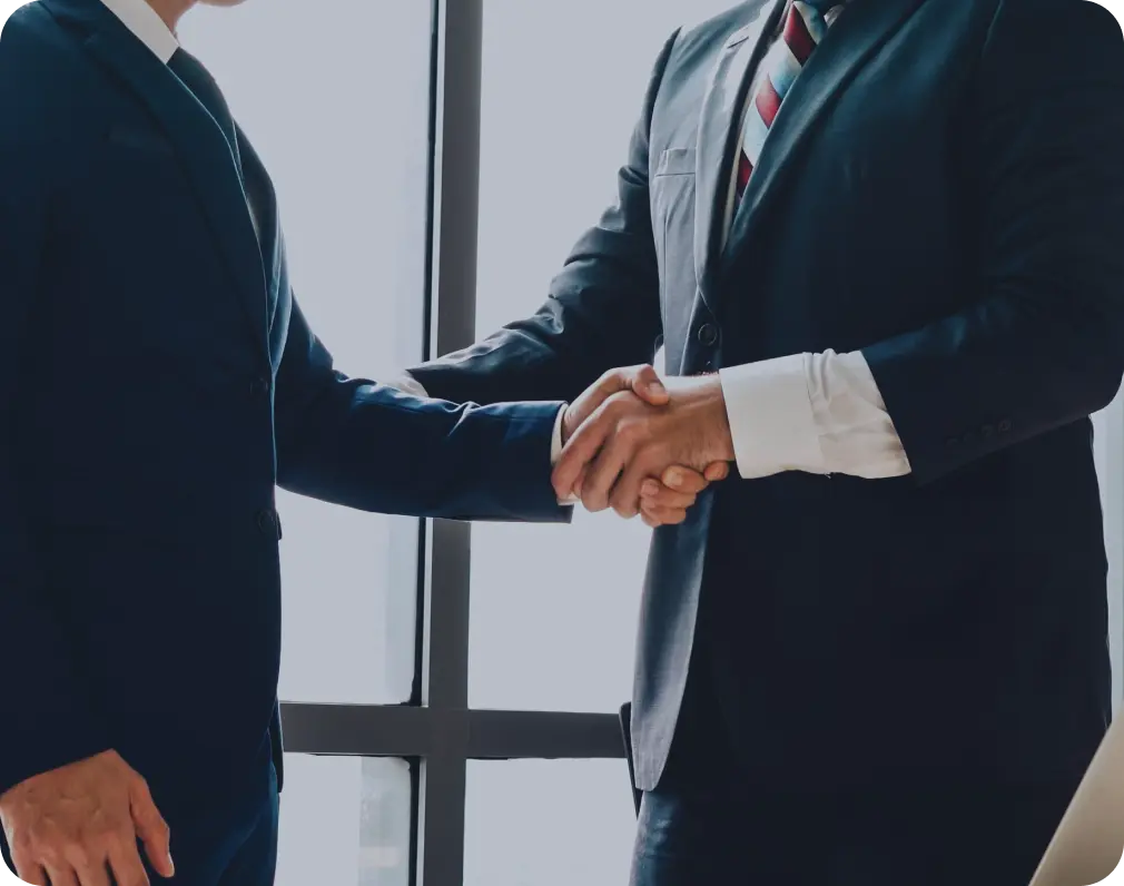 Establish Company In Dubai: Business Partners Shaking Hands in Professional Setting