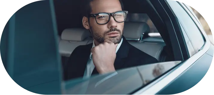 Professional businessman contemplating Company Formation in Dubai from luxury vehicle