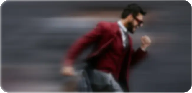 Company Formation In Dubai: Motivated professional in motion with blurred background