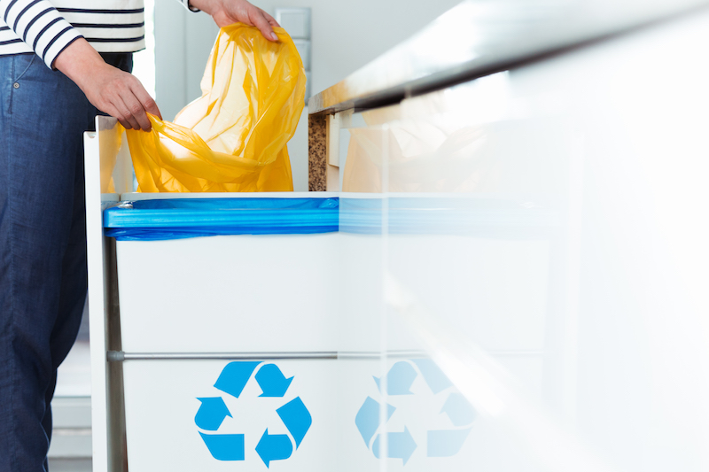 Modern kitchen with recycling bin