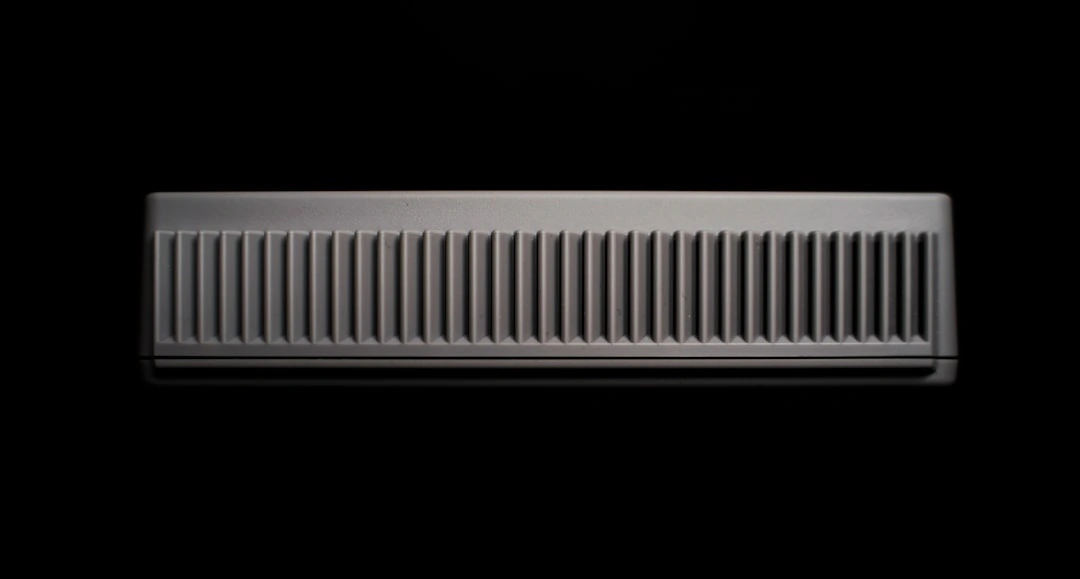 a sleek indoor ductless mini-split unit mounted on a modern living room wall - how a new hvac system increases home value
