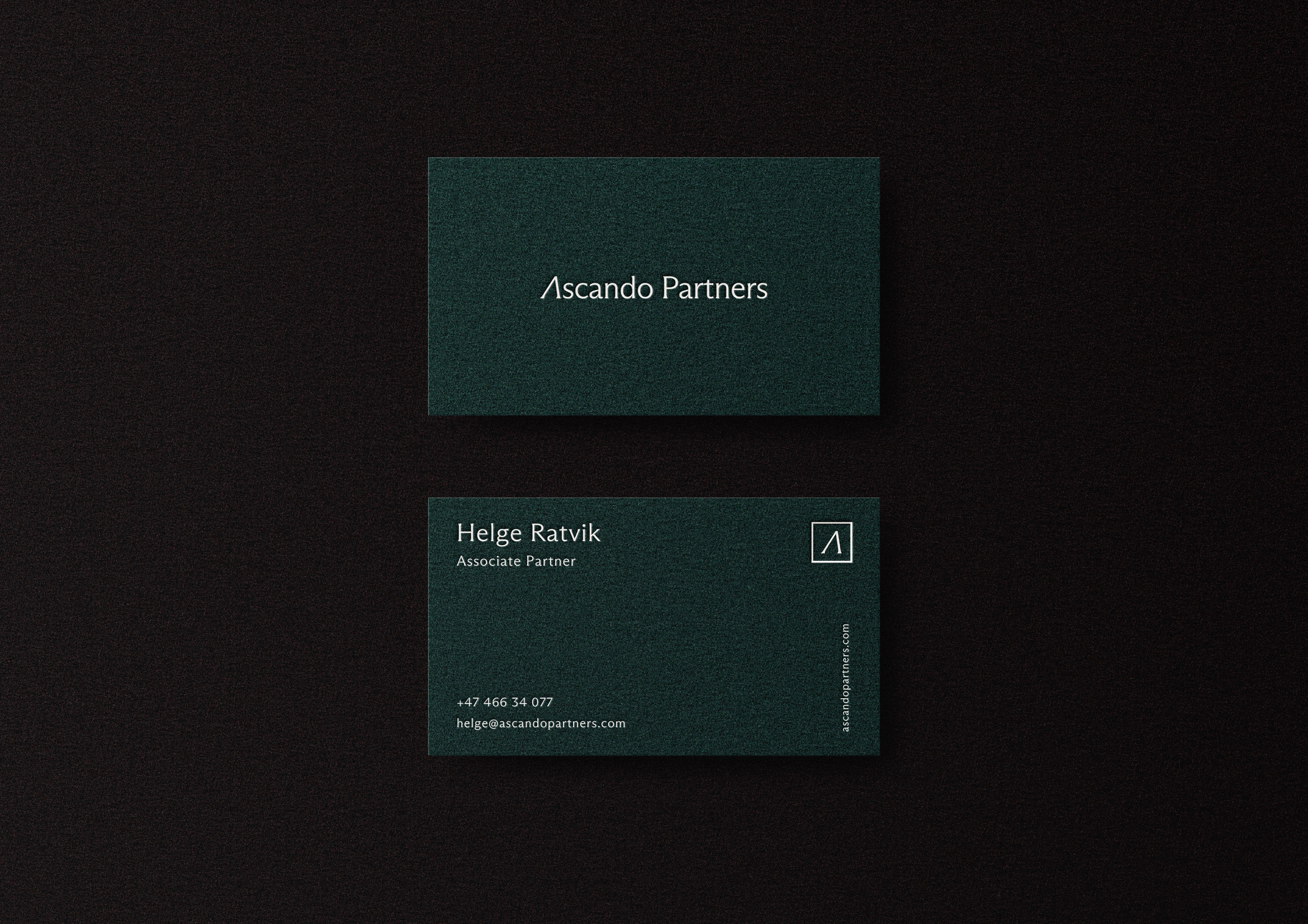 Two dark green business cards for Ascando Partners with white text; one card shows the company name, the other shows contact details for Helge Ratvik, Associate Partner.