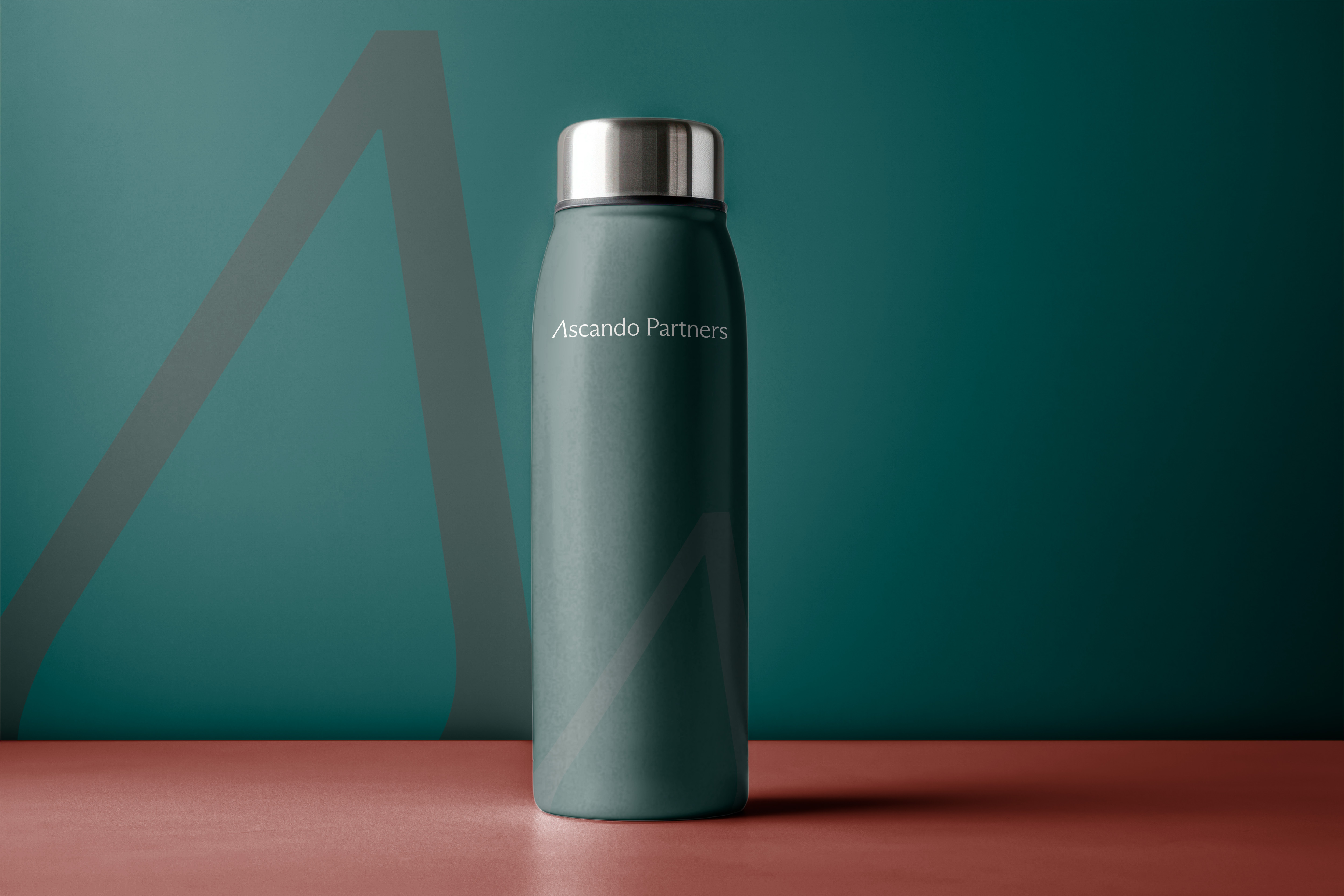 Metallic teal water bottle with a silver cap labeled 'Ascendo Partners' against a teal and brown background.
