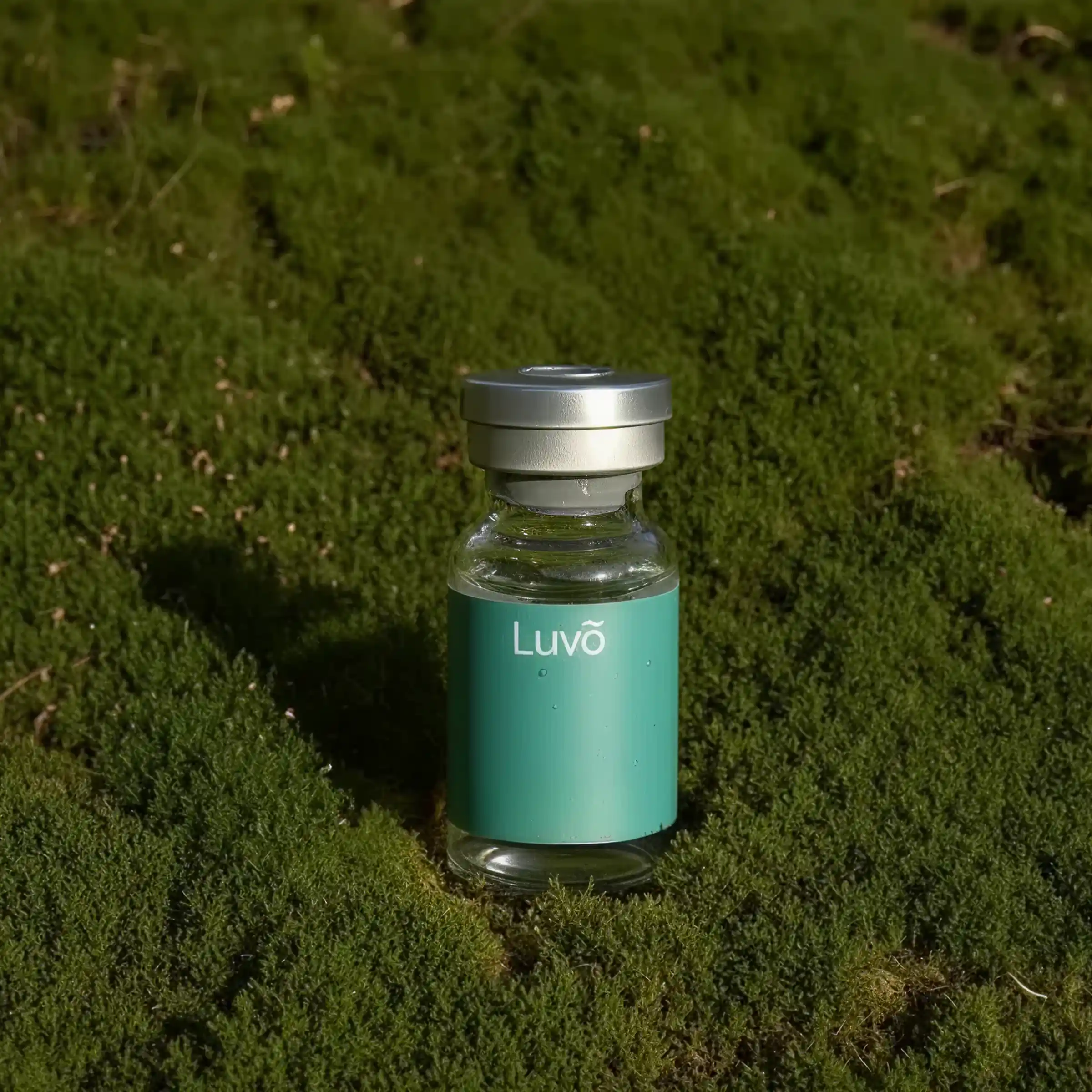 Illustrative semaglutide injection vial on moss from a wider angle