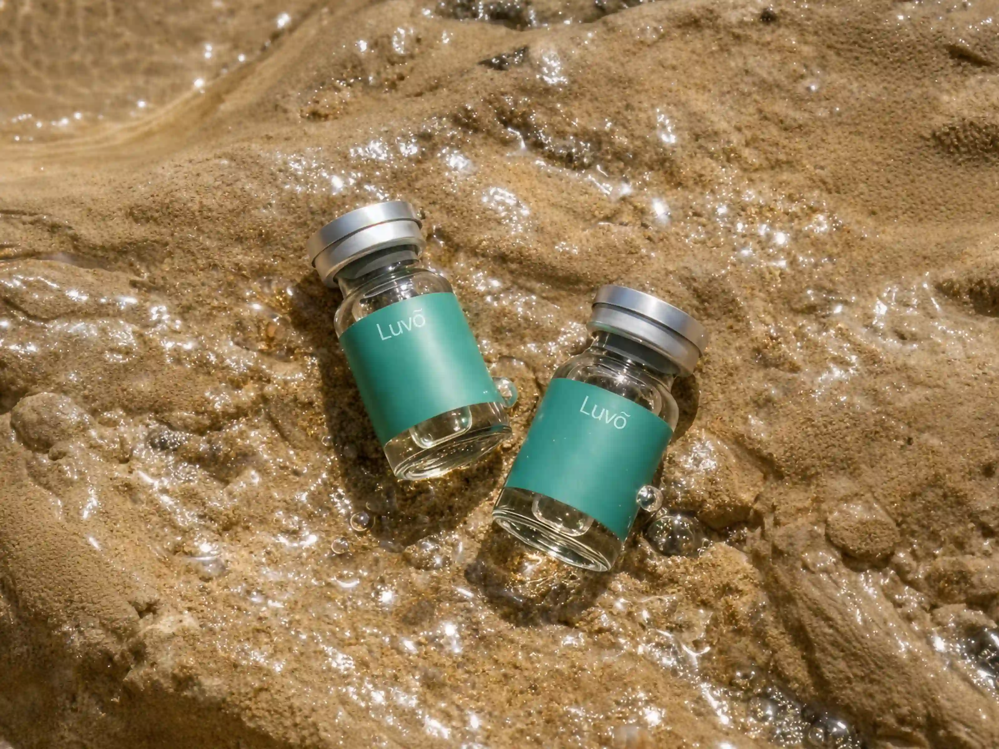 Illustrative semaglutide injection vials on a sandy surface