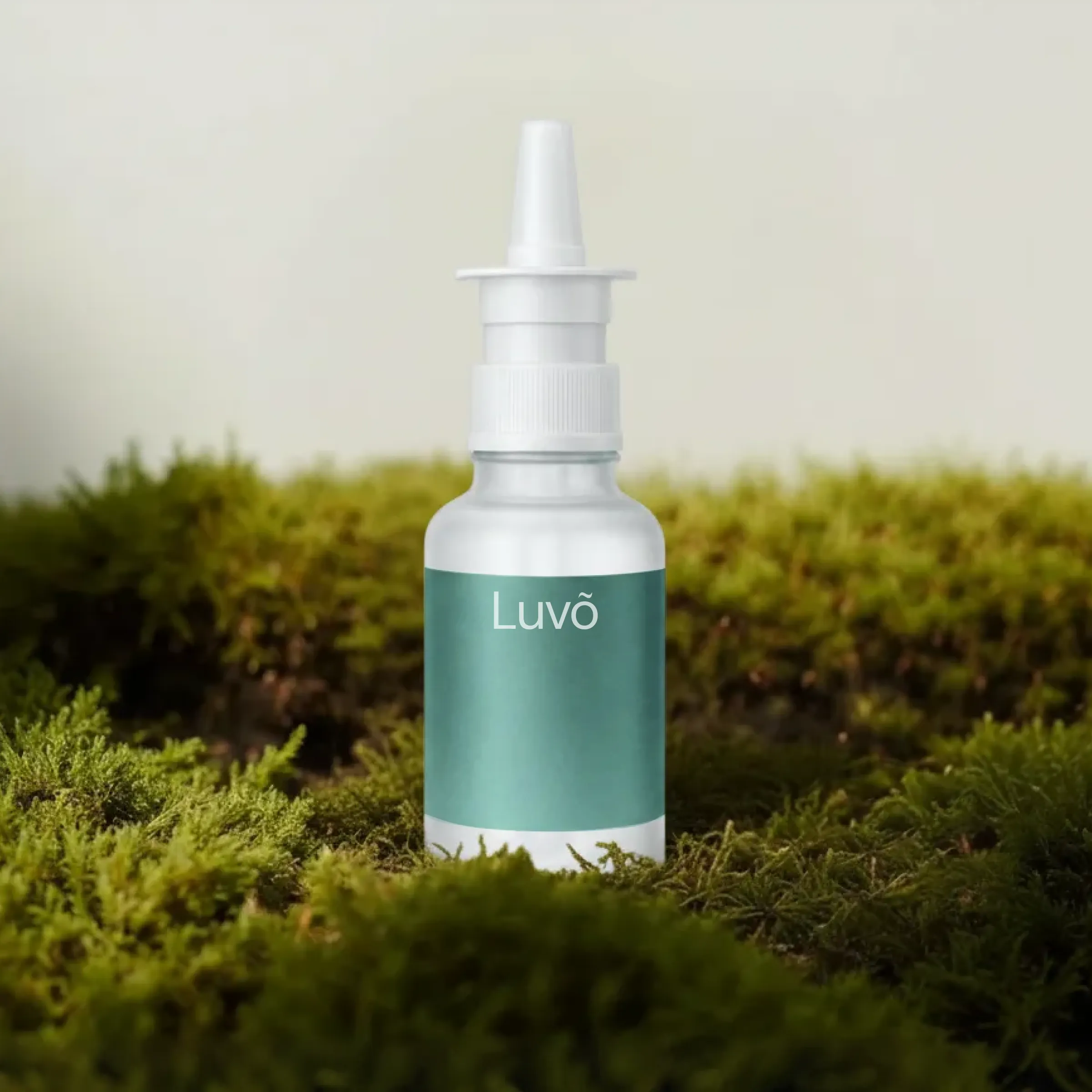 NAD+ nasal spray bottle on moss