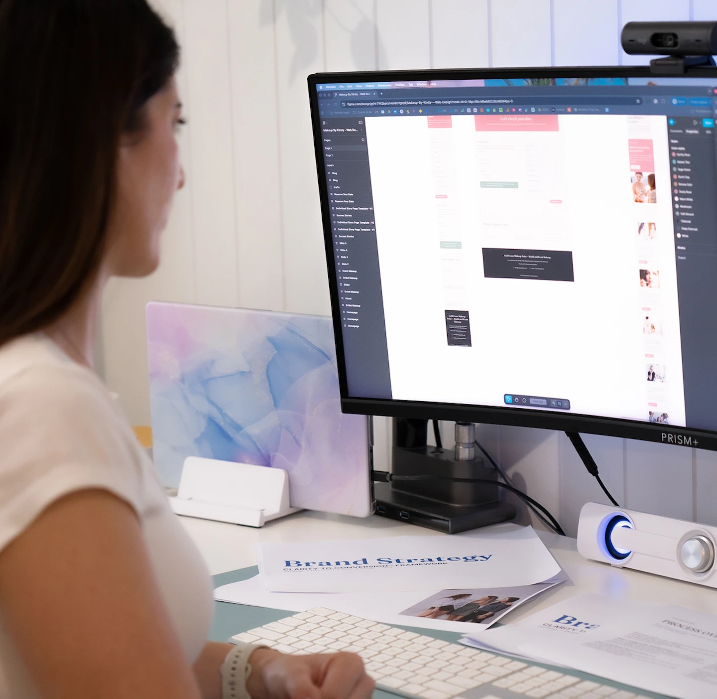 Designer reviewing layouts and visuals as part of a website audit