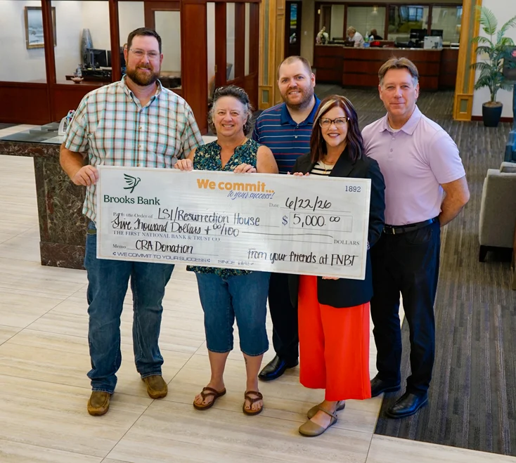 LSI/Resurrection House Receive a Donation from Brooks Bank