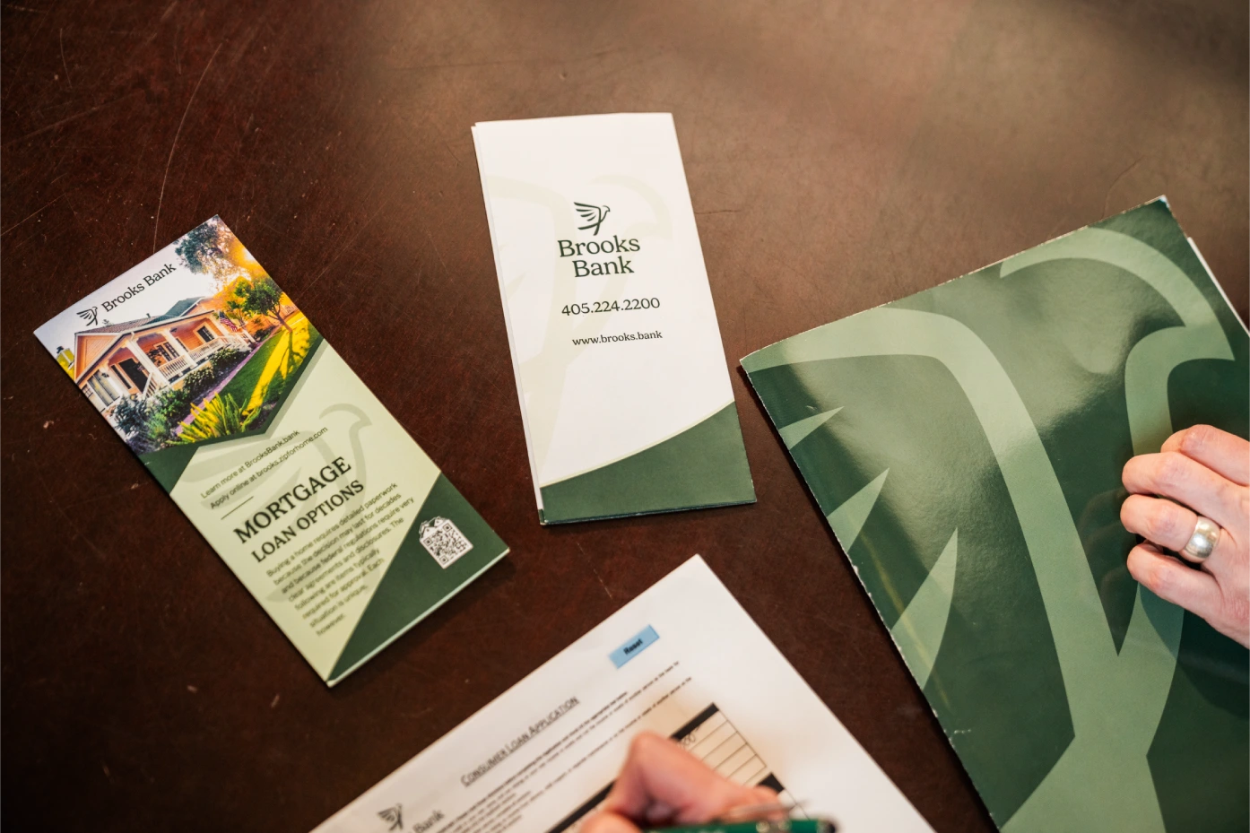 Brooks Bank mortgage loan options brochure and folder on a desk
