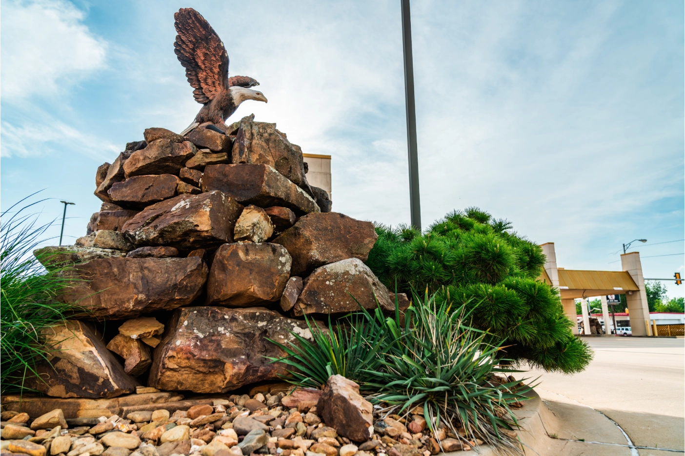 Eagle sculpture on a stone cairn at the Brooks Bank Chickasha Eagle branch