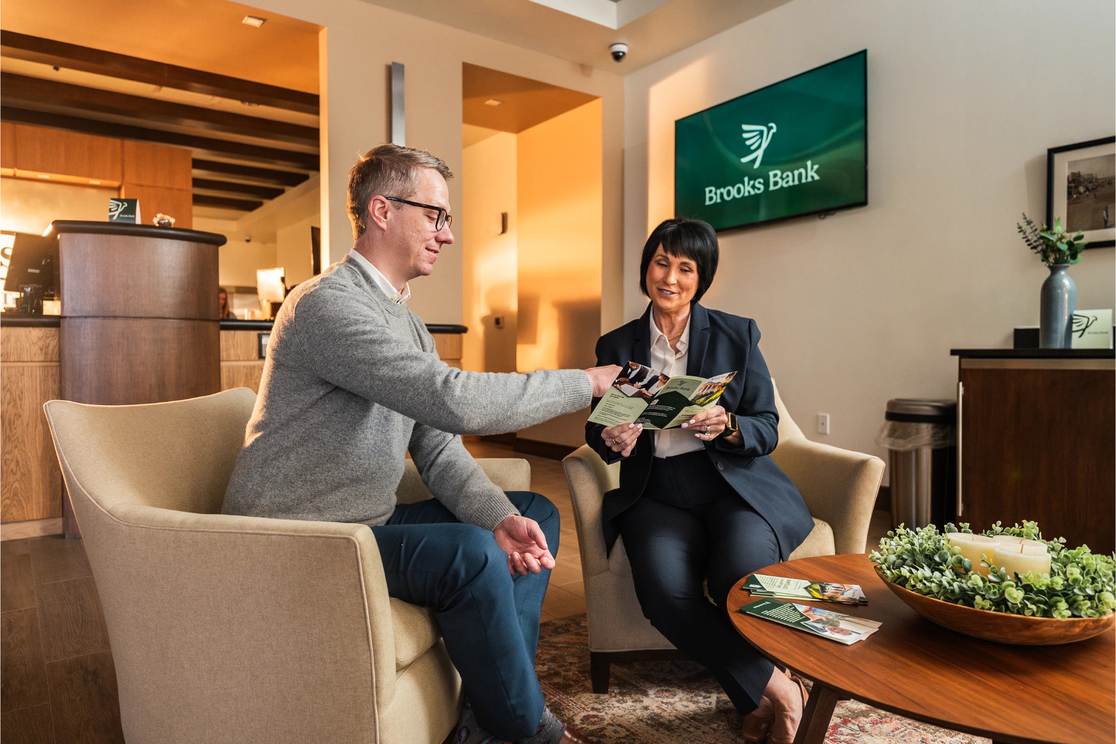 Brooks Bank mortgage lender going over loan options with a homebuyer
