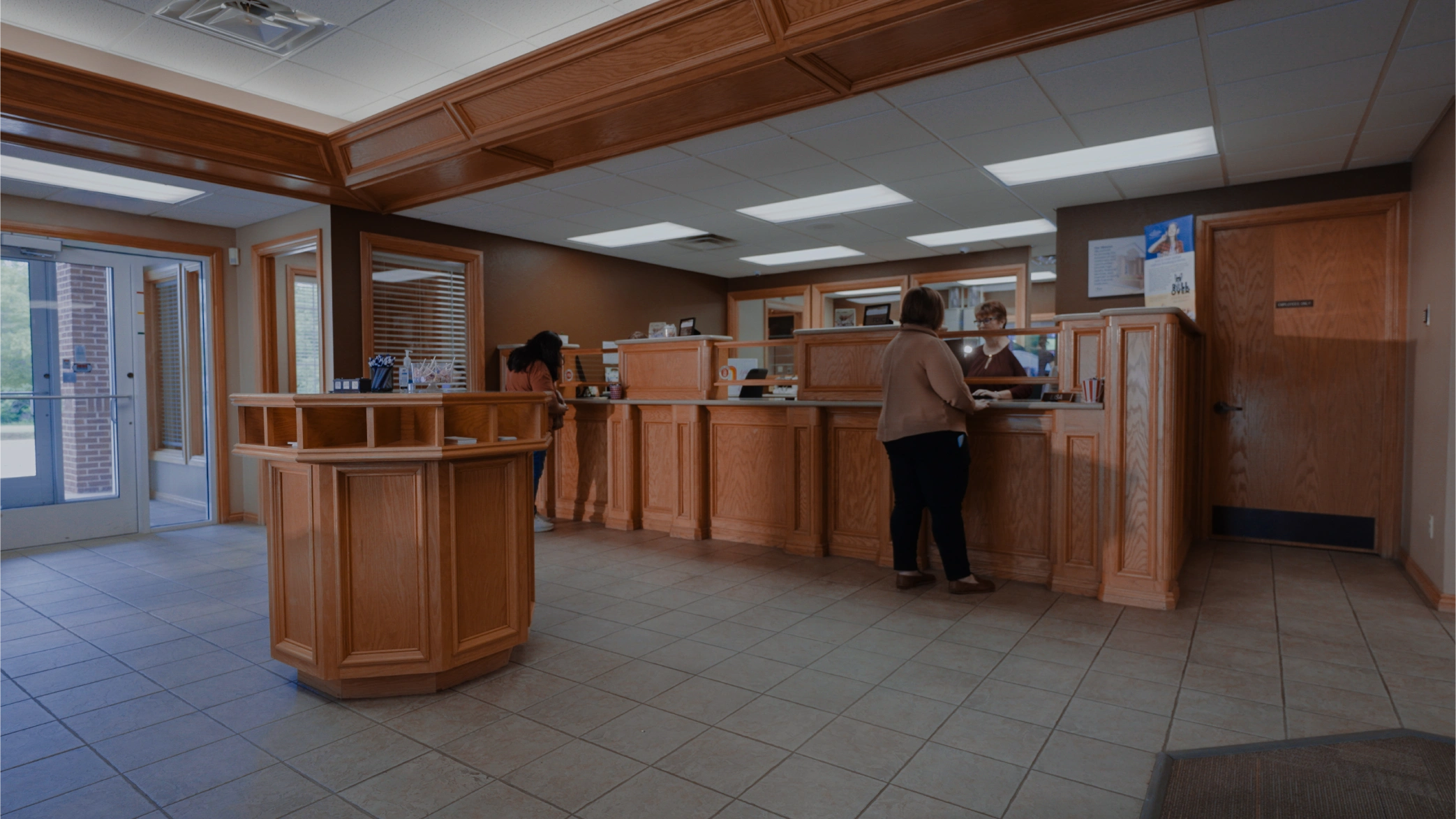 Staff at the teller counter inside the Brooks Bank Newcastle branch