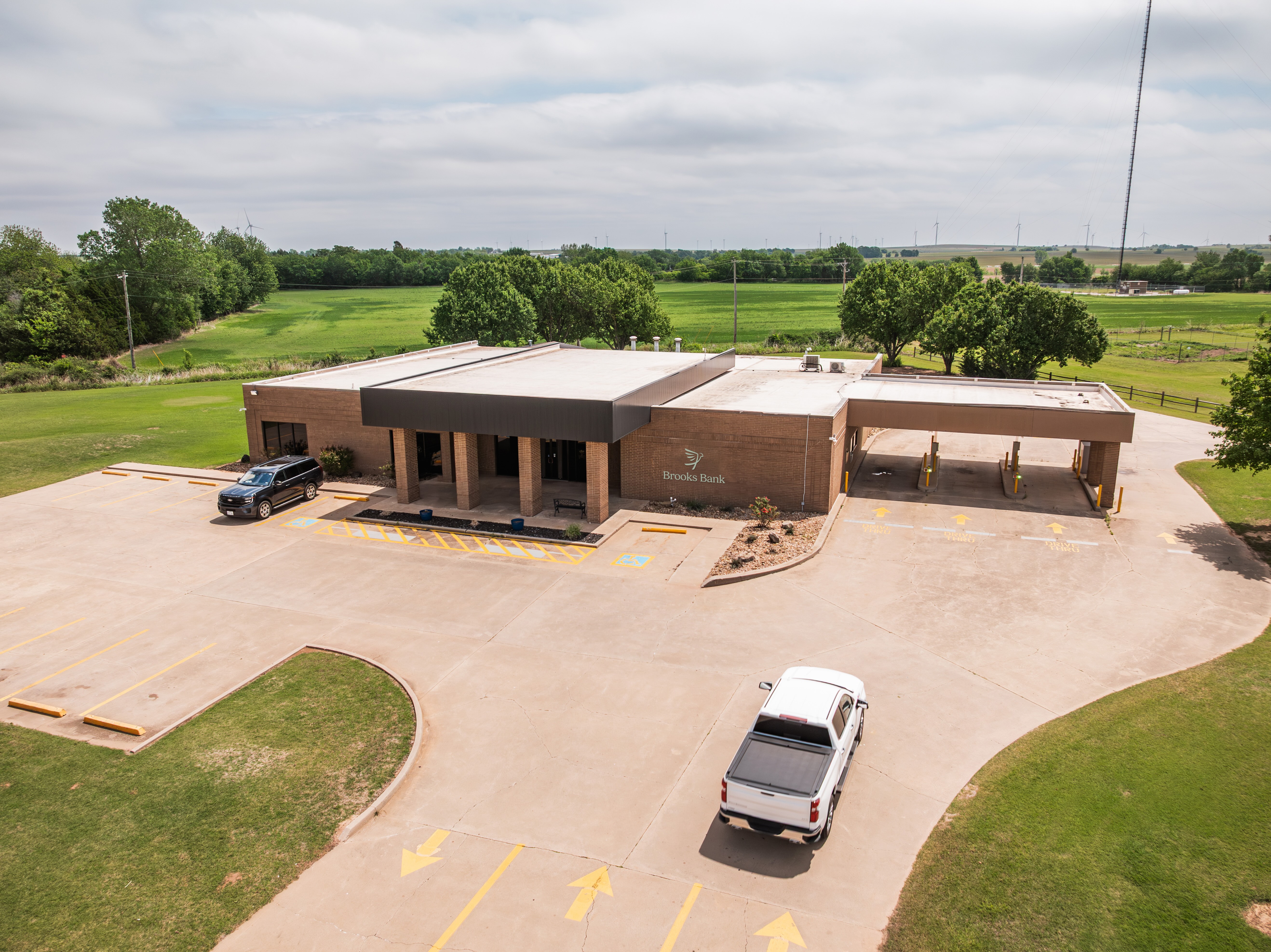 Aerial view of the Brooks Bank Minco branch beside open farmland