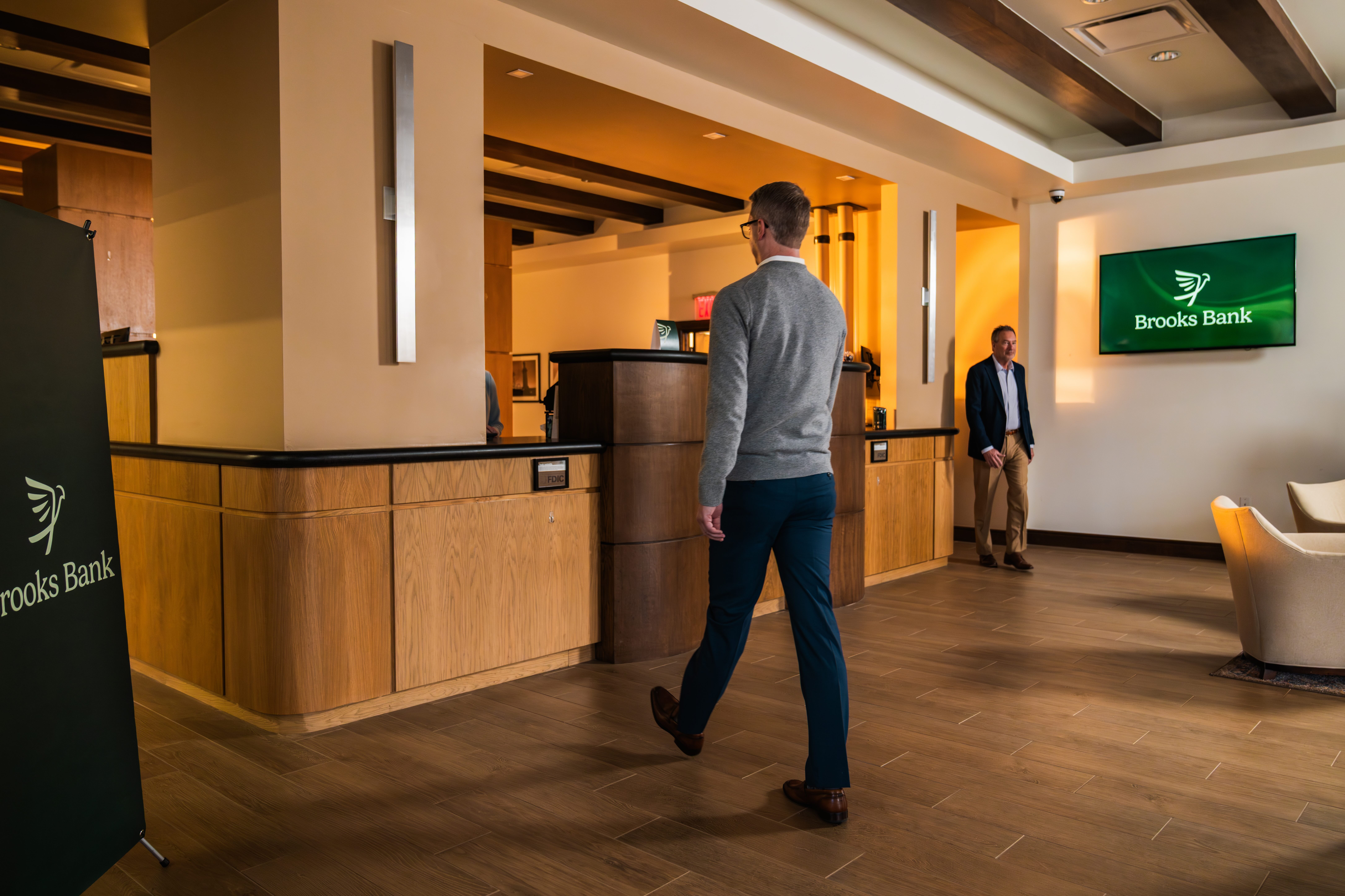 Customer walking through the Brooks Bank Tuttle branch lobby
