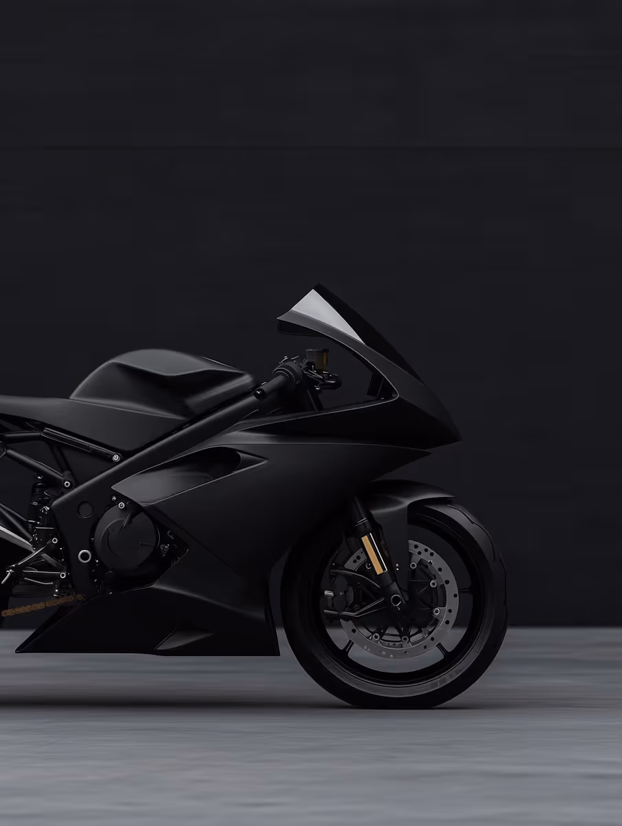 Side view of a sleek black sport motorcycle against a dark background.